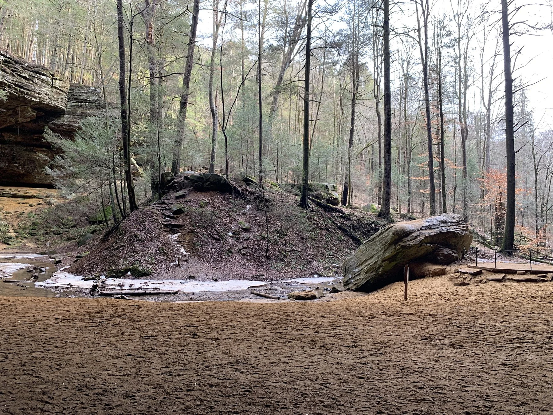 An ancient mound of ash in a gorge at the base of a waterfall, thought to have been created by early Native American peoples.
