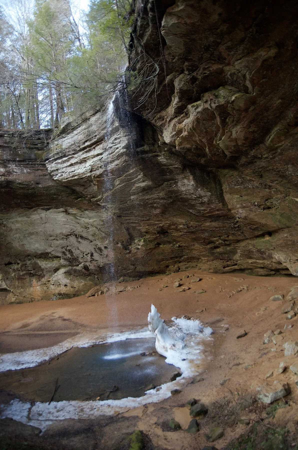 An ice stalagmite at the base of Ash Cave's waterfall.