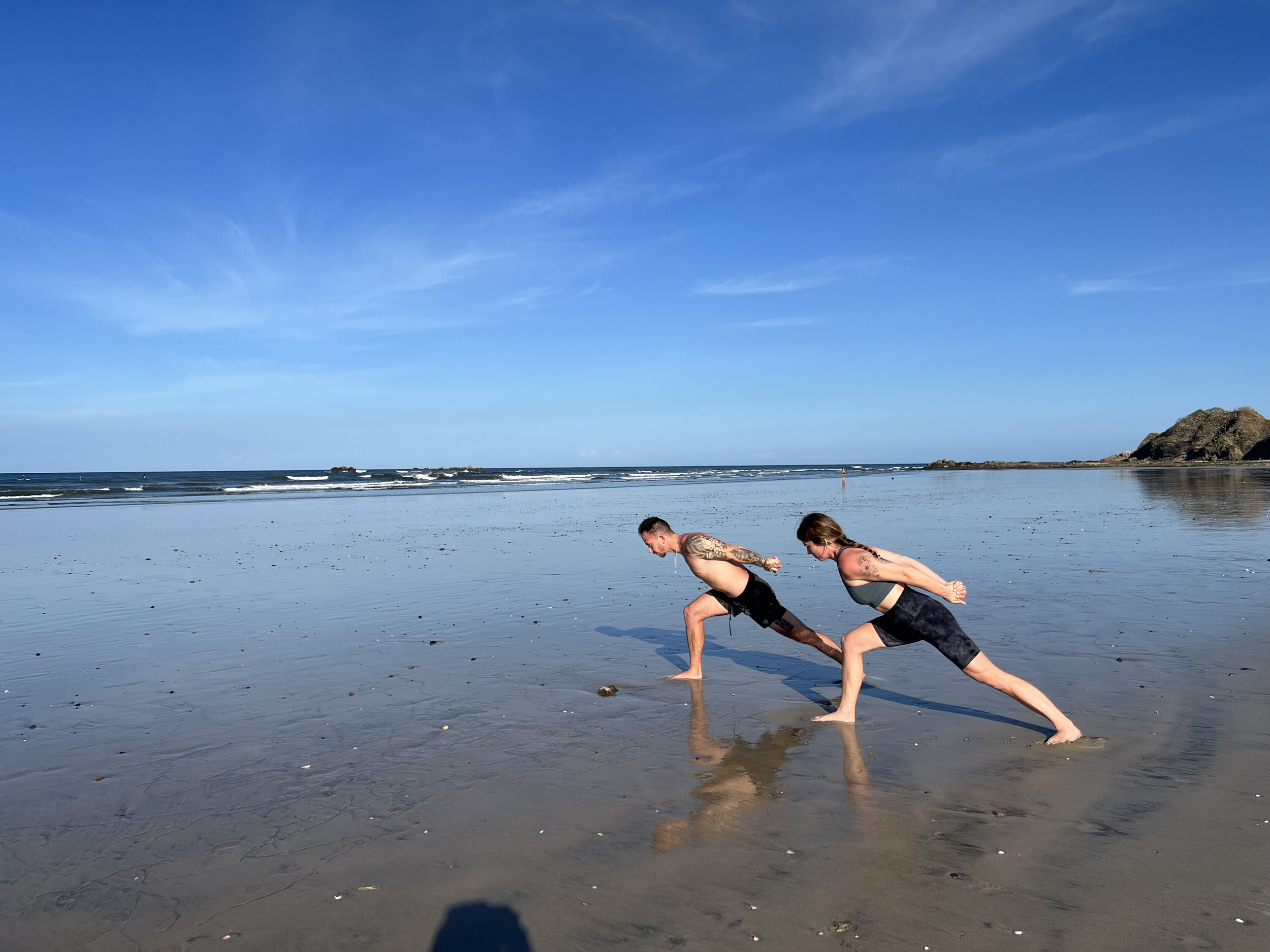 Aubrey and Art practicing on the beach
