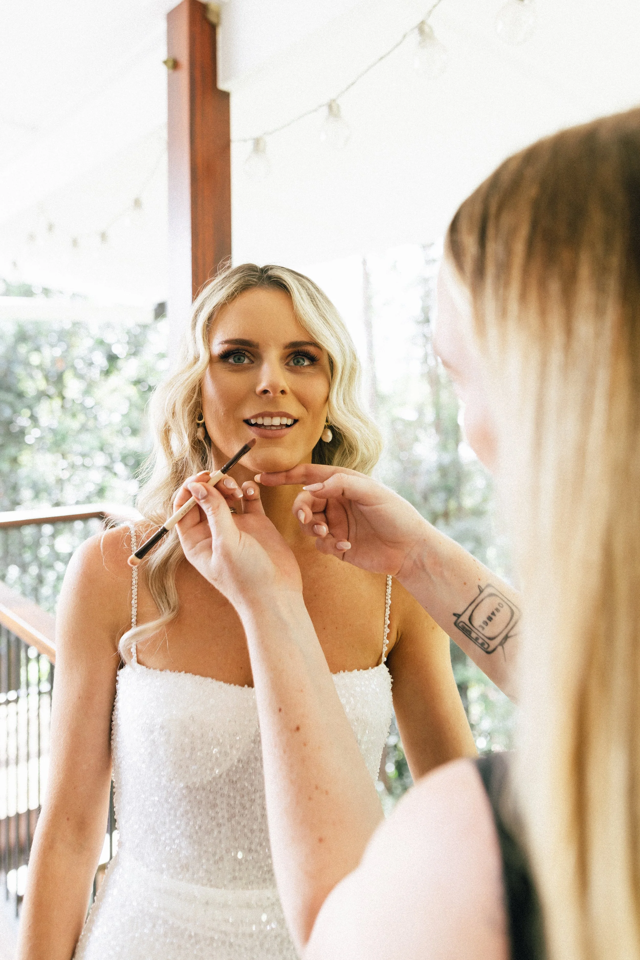 Bride getting her make up done by Alice Cameron 