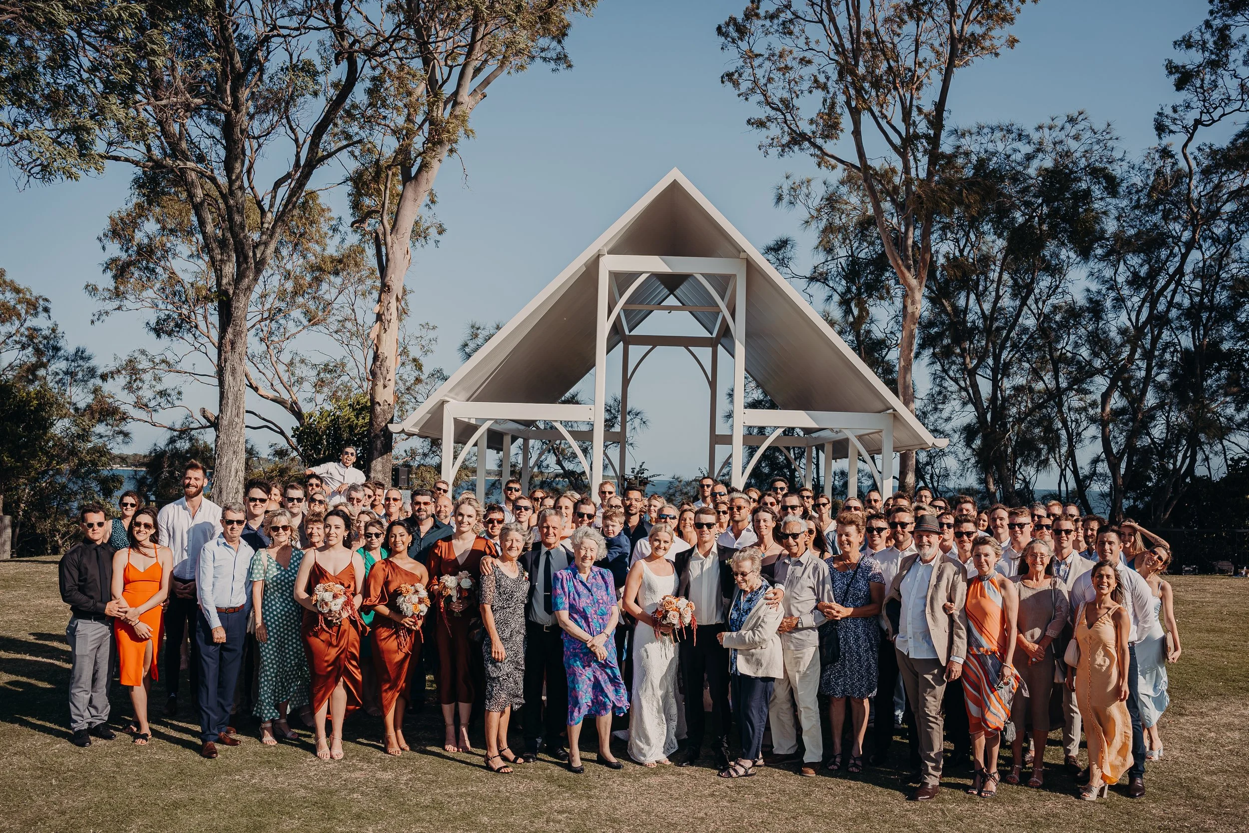 All guests celebrating outside the Sandstone Point Hotel Pavillion