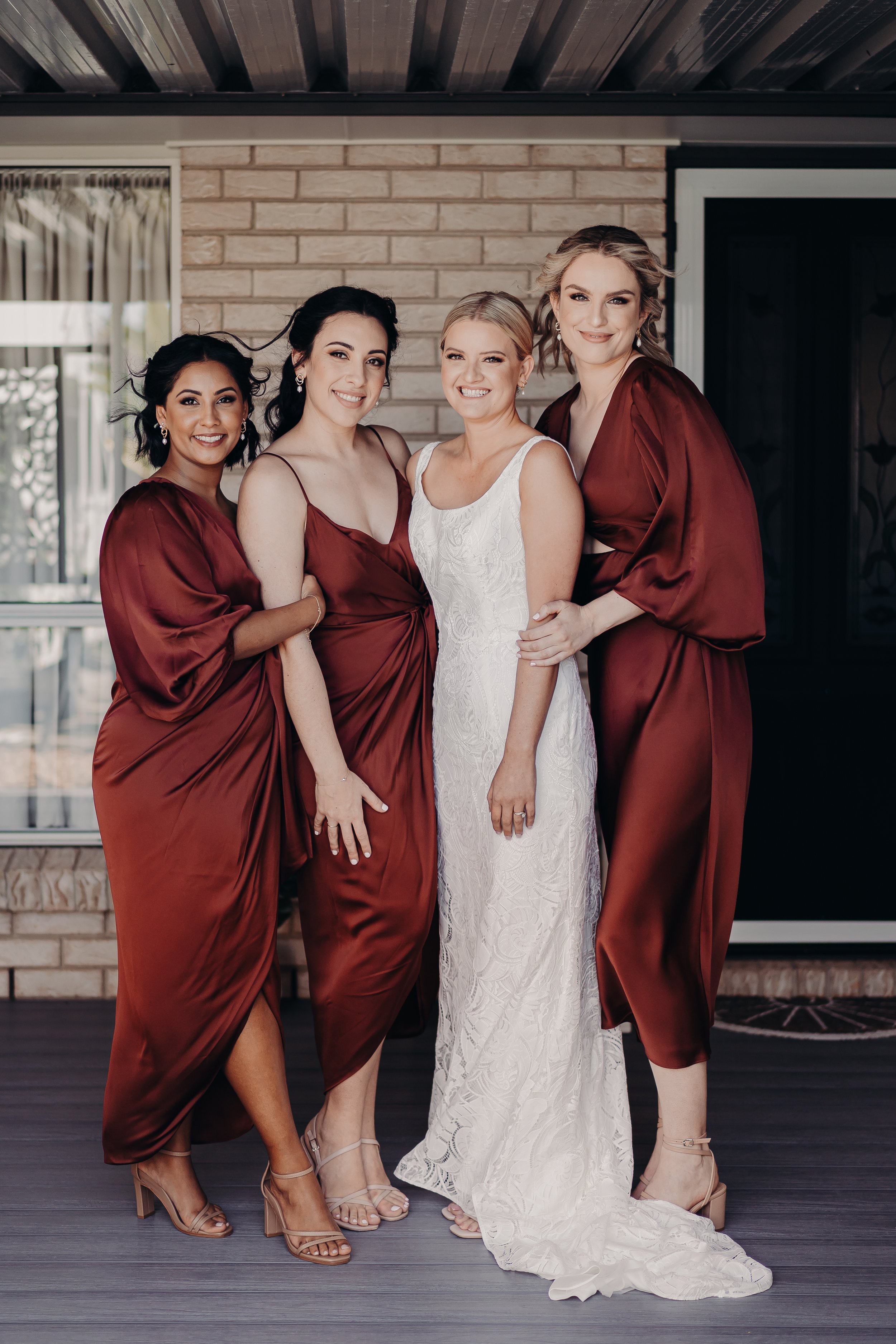Bride and her bridesmaids getting ready before the wedding ceremony at Sandstone Point Hotel