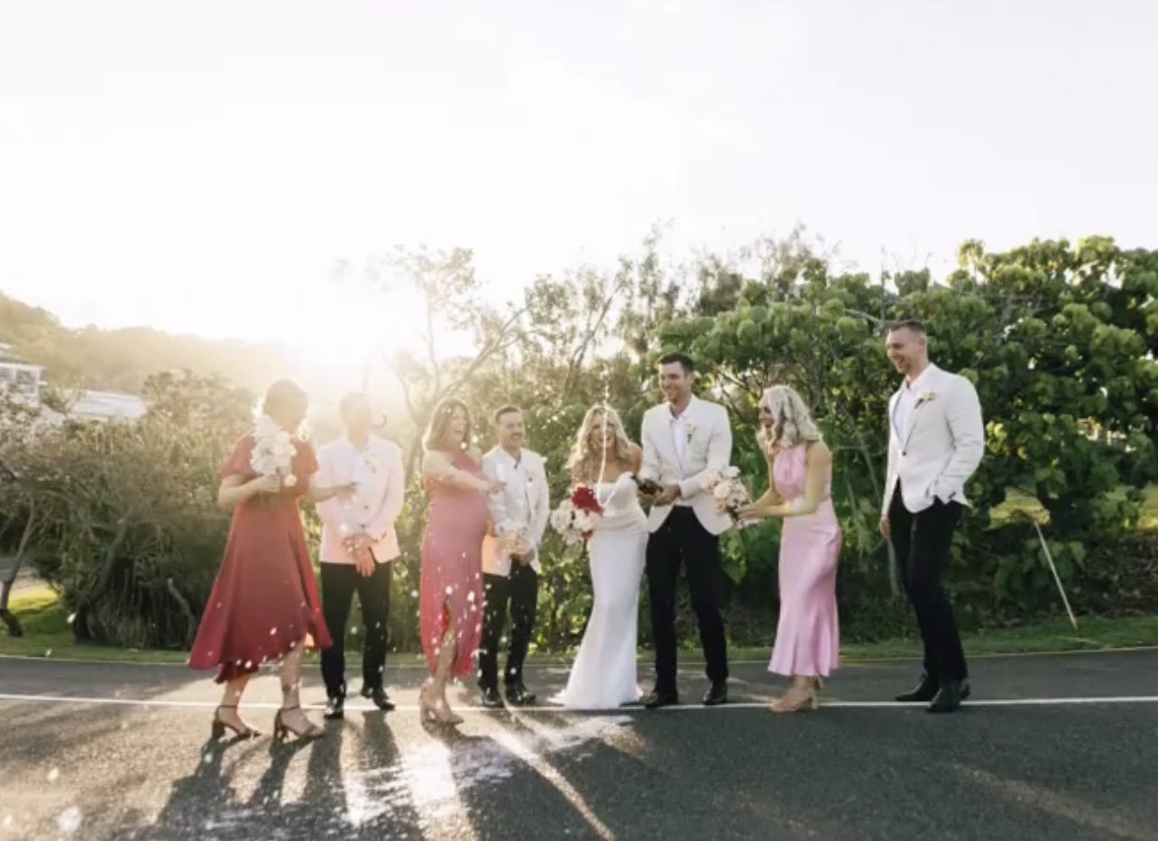 Bride & Groom celebrating with their bridal party after their marriage ceremony. 