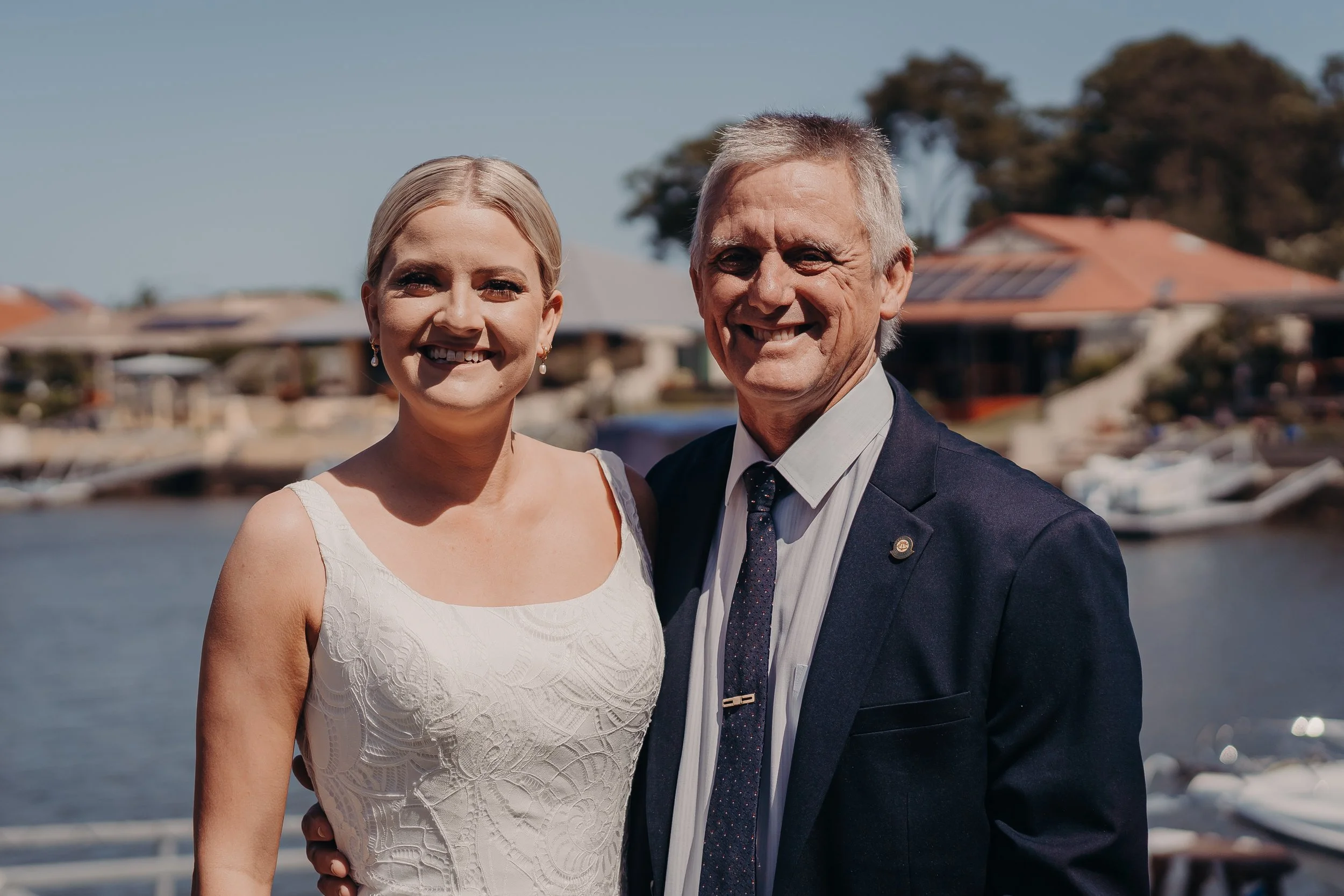 Bride and her father getting ready before the wedding ceremony. 