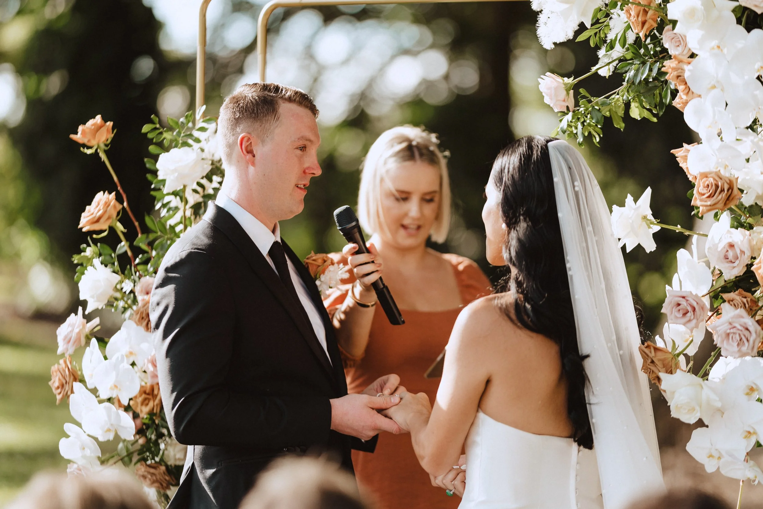 Sunshine Coast Celebrant supports Bride and Groom as they share their vows.