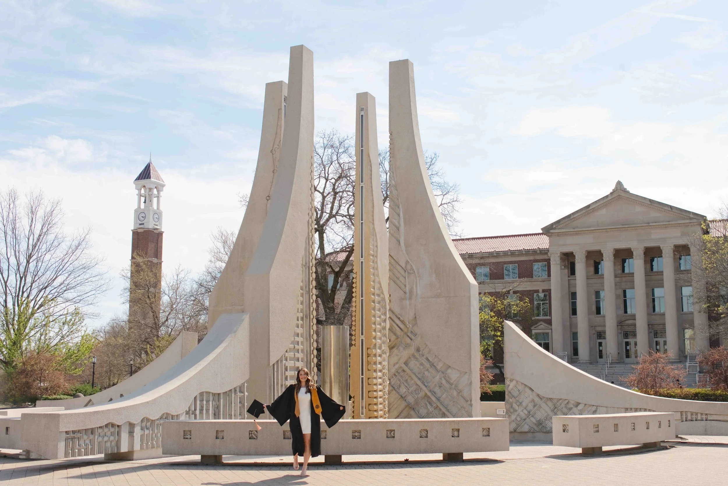 Purdue graduation pictures with engineering fountain and bell tower in the background.  Photo by Heather Corbin Photography.