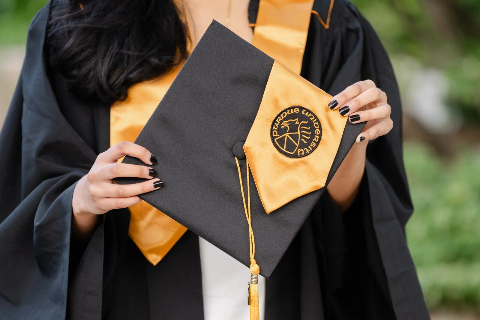 Close up picture of Purdue graduation cap and stole.  photo by Heather Corbin Photography