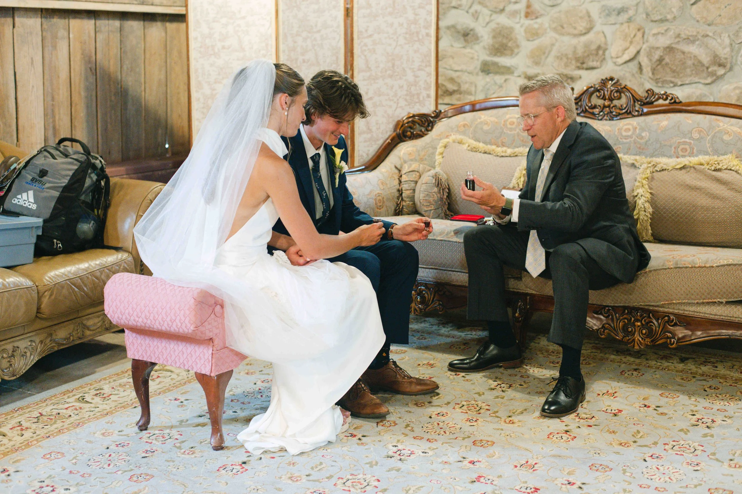 Bride and groom receiving private Holy Communion together between their wedding ceremony and the reception.