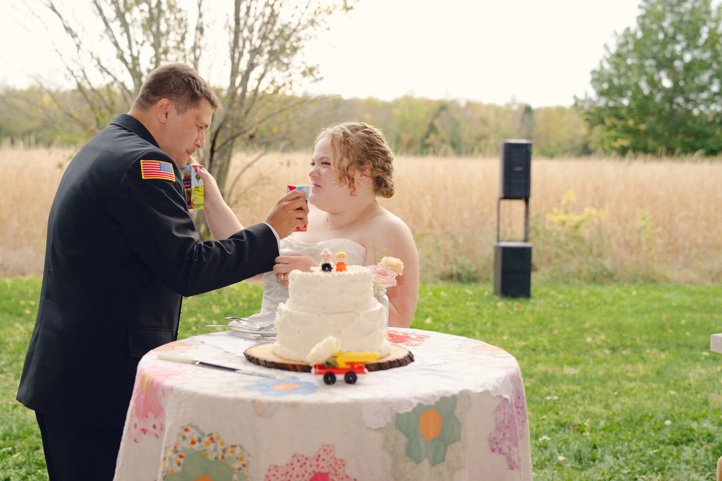 Juice box toast at outdoor wedding