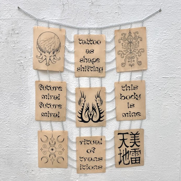 "Skin Tapestry" -
tattoo ink, silicone skin, chain -
36x42 inches -
2022