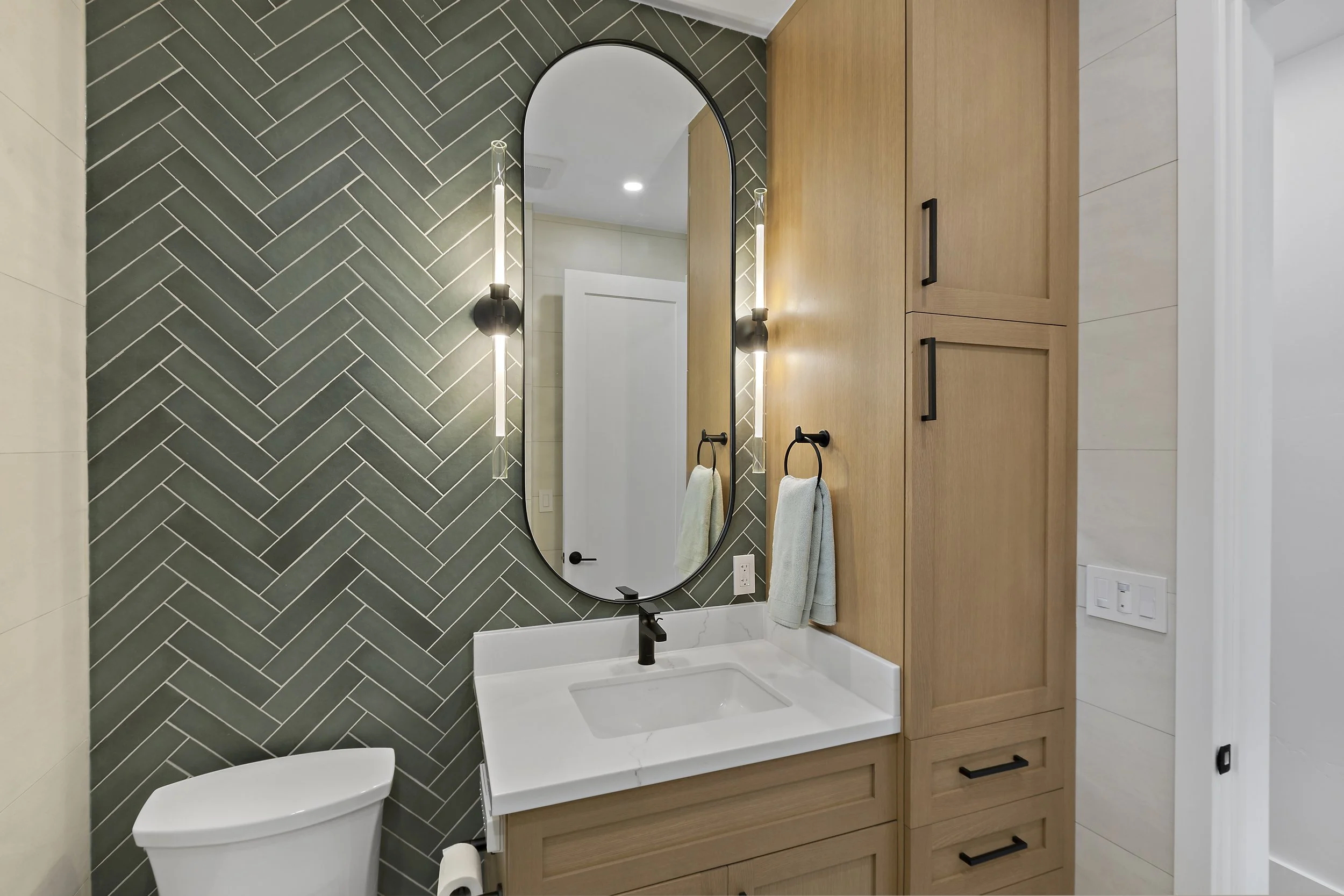 Small modern bathroom designed to maximize efficiency with smart space planning, functional storage solutions, and elevated contemporary finishes.