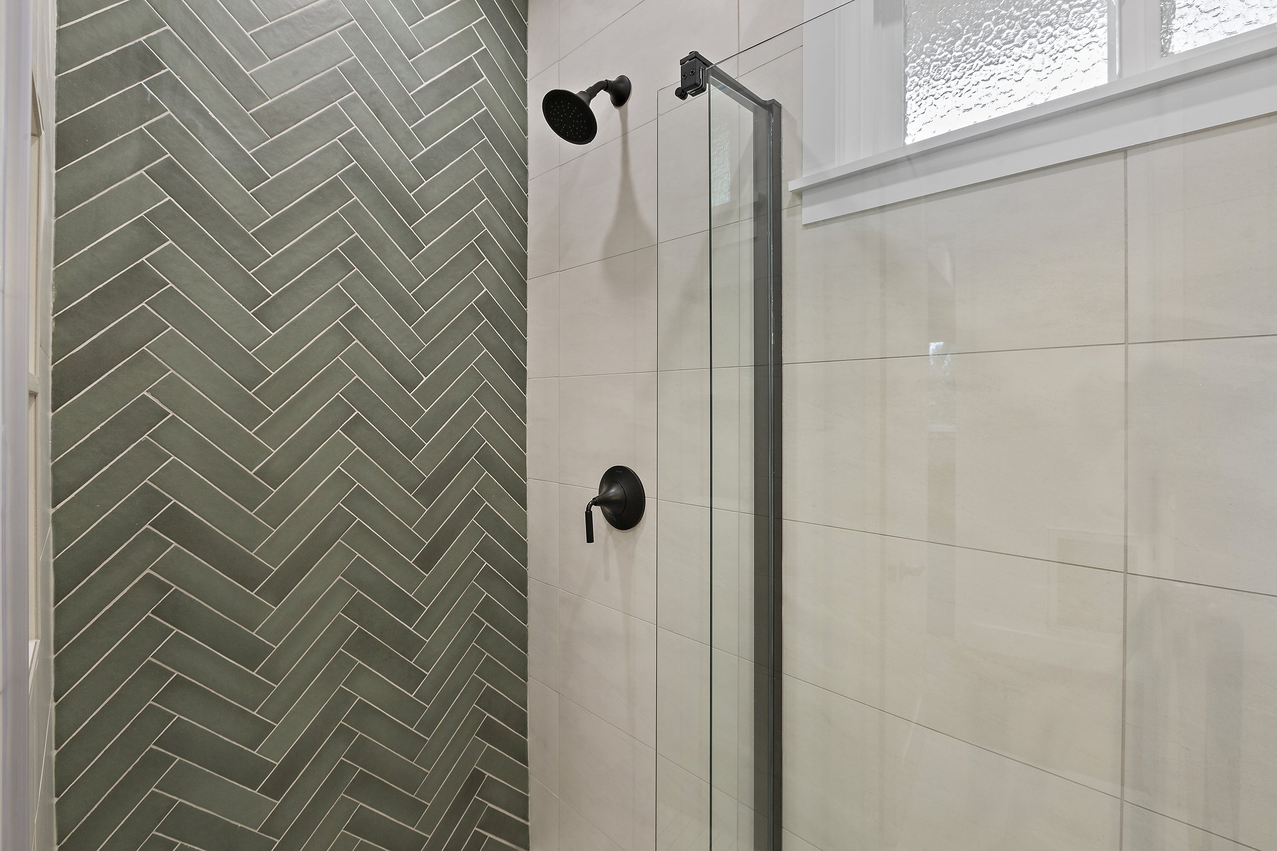 Small modern bathroom designed to maximize efficiency with smart space planning, functional storage solutions, and elevated contemporary finishes.