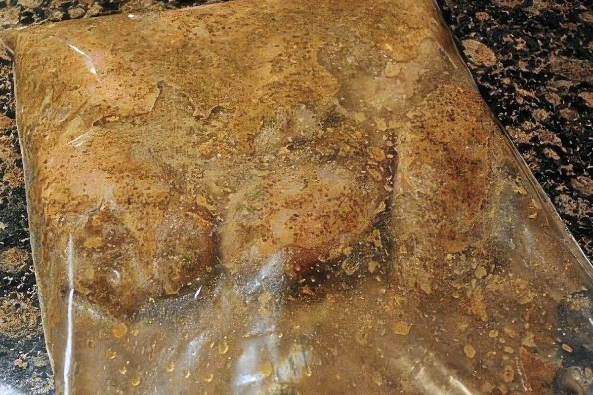 Jerk Chicken marinating in a plastic zip bag.