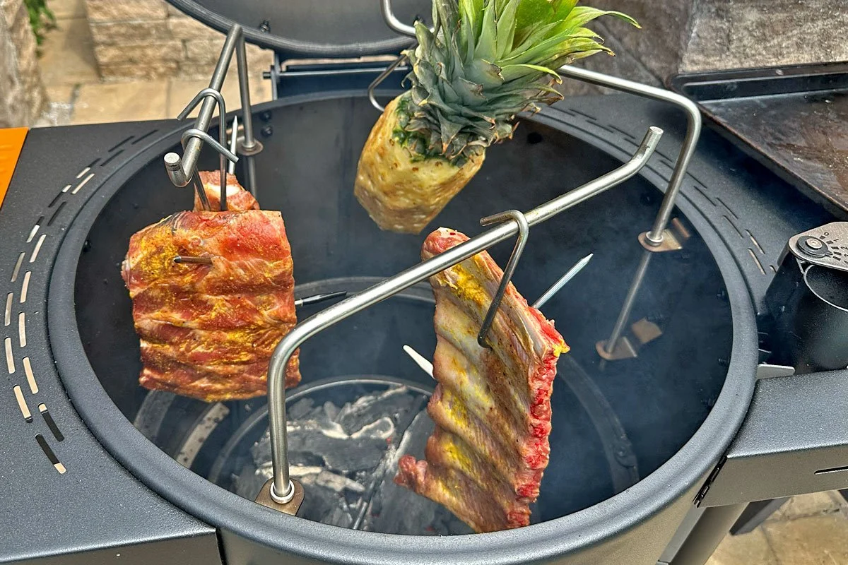 Spare ribs and pineapple on hooks.