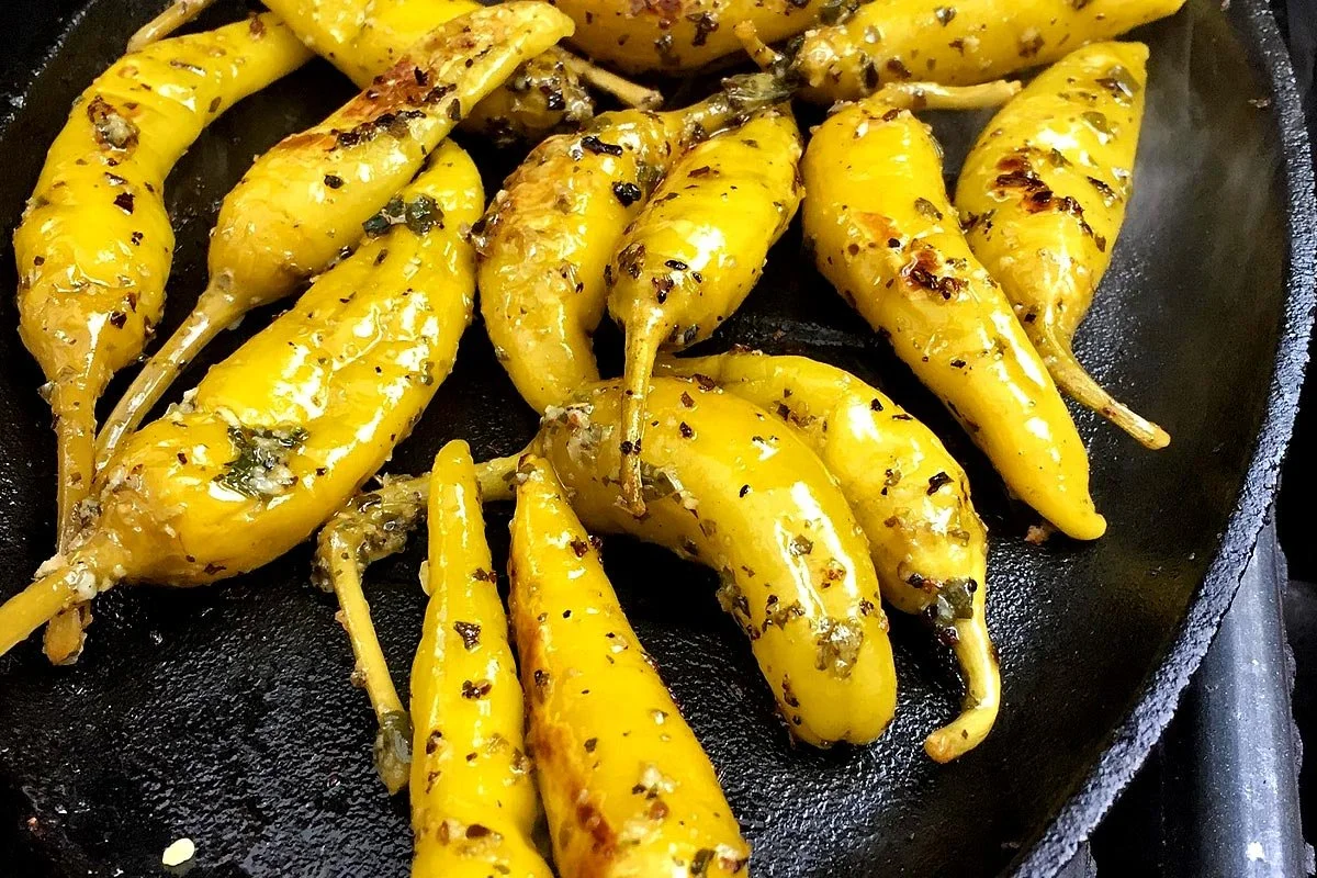 Peppers in cast iron on the grill.