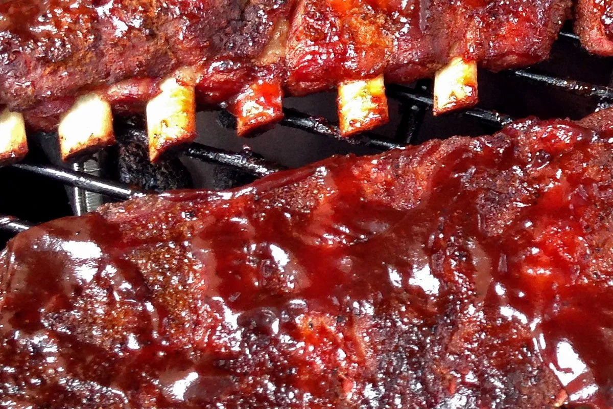 Baby back ribs with sauce on the smoker