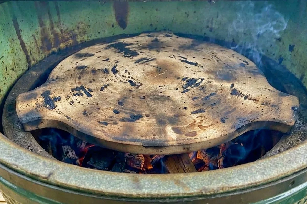 Heat shield inside a kamado grill.