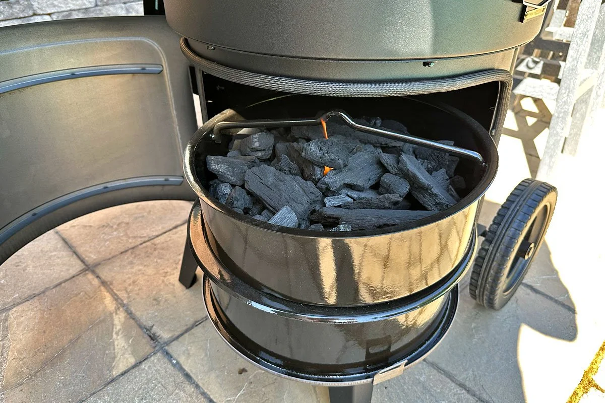 Charcoal access on the Oklahoma Joe's Bronco drum smoker.