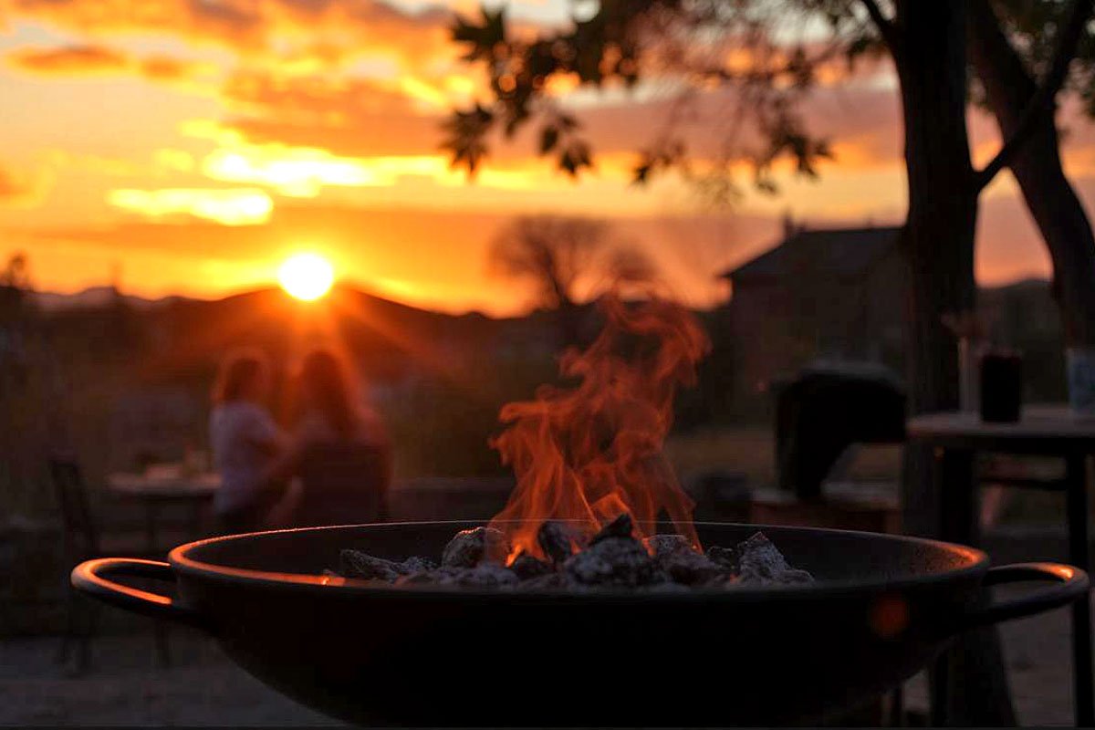 Sunset grilling in a backyard.
