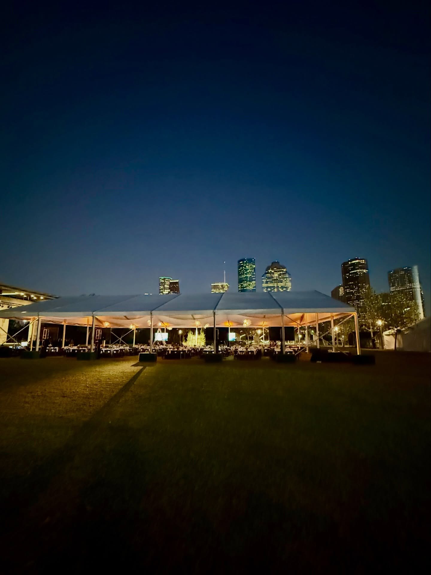 Our AOTE tent set up at Buffalo Bayou Park with the Houston skyline behind it. Hard to ask for a better backdrop. 🌃 #cityviews #tentrentals #eventrentals #houstontents