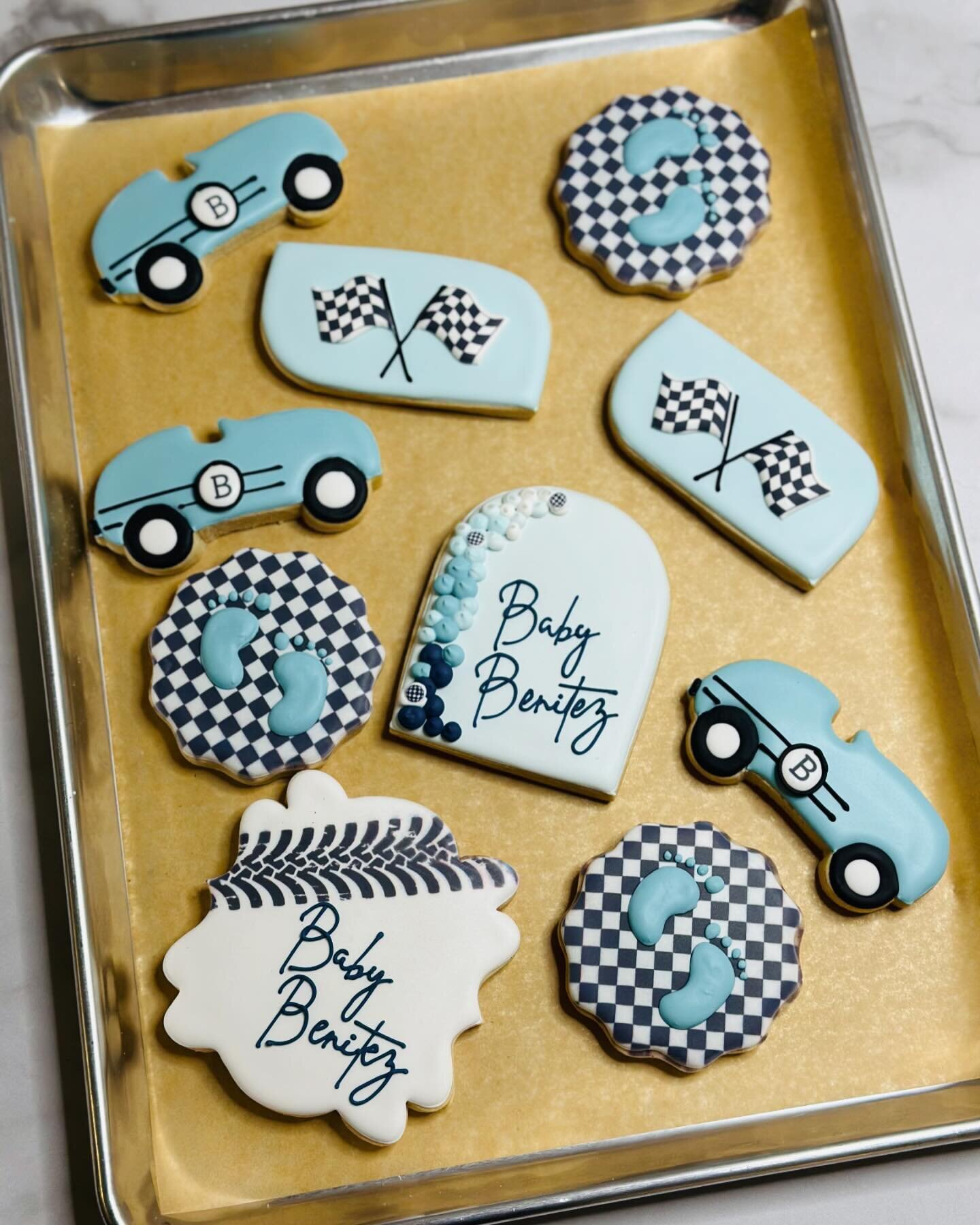 Revving up for the cutest baby shower ever with these race car themed cookies! 🏁🍼 From checkered flags to little race cars, every bite is a sweet celebration of the journey ahead. #RaceCarBabyShower #SweetStarts #BabyOnBoard #MomToBe #DessertTableG