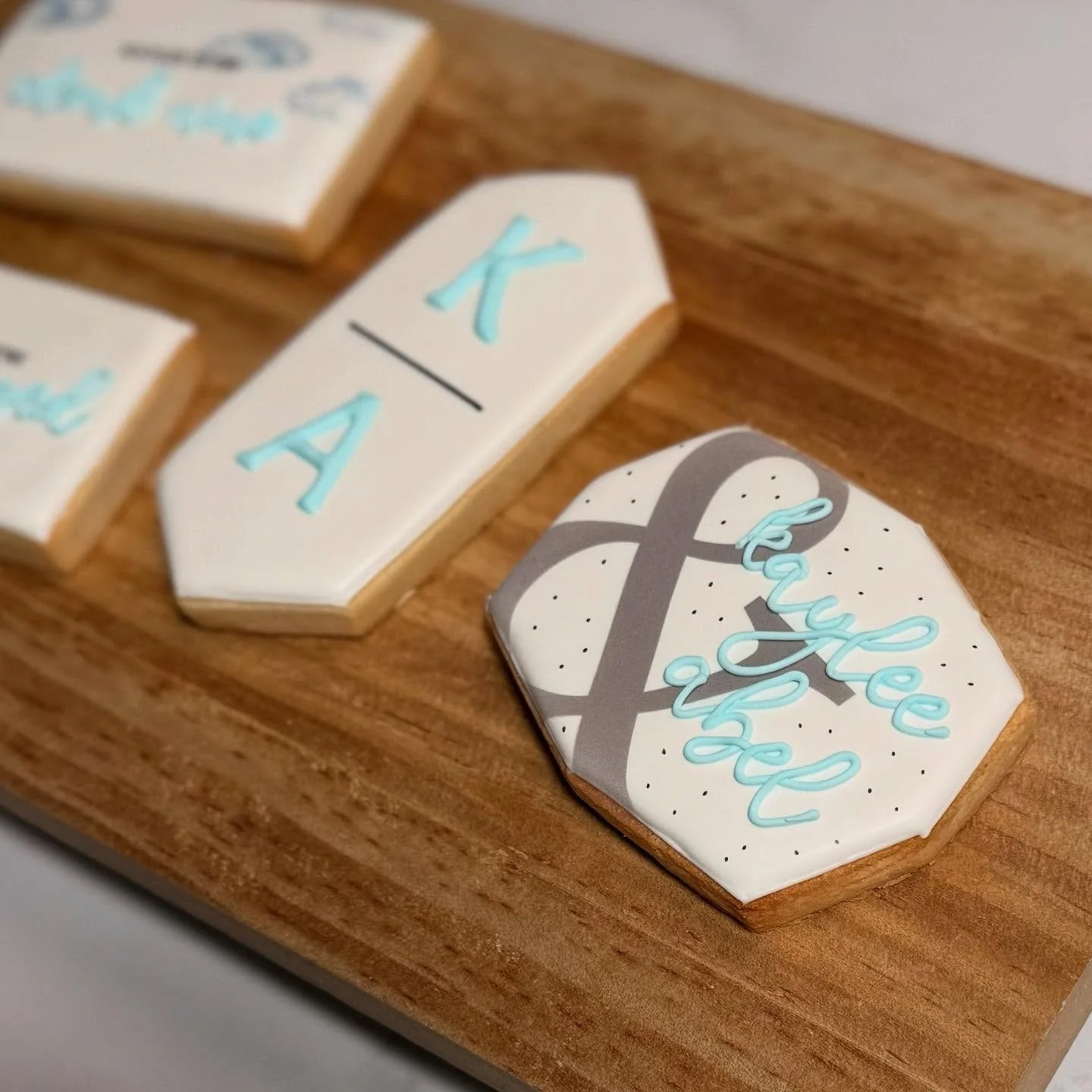 Floating on cloud nine for the happy couple! This engagement set was inspired by their dreamy theme with white, black, and soft blue tones to match. Love is definitely in the air&mdash;and on these cookies!

#customcookies #decoratedcookies #royalici