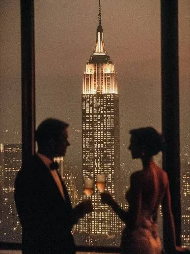 Couple drinking champagne over Manhattan skyline