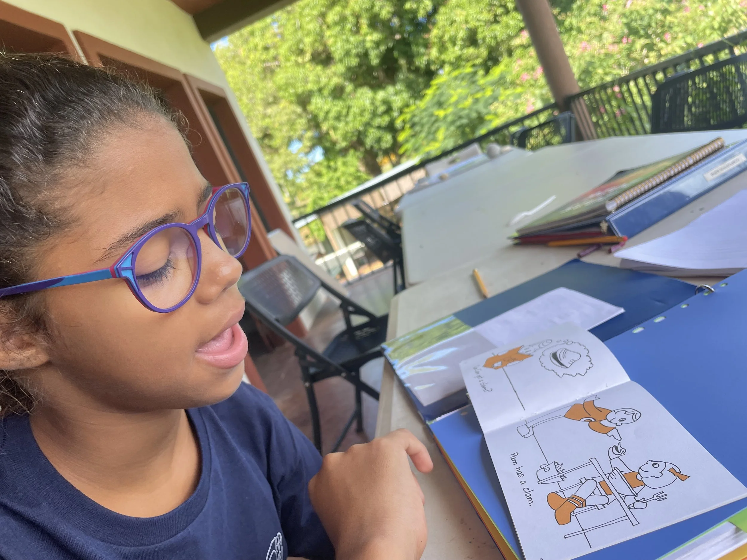 Dominican student learning how to read in English
