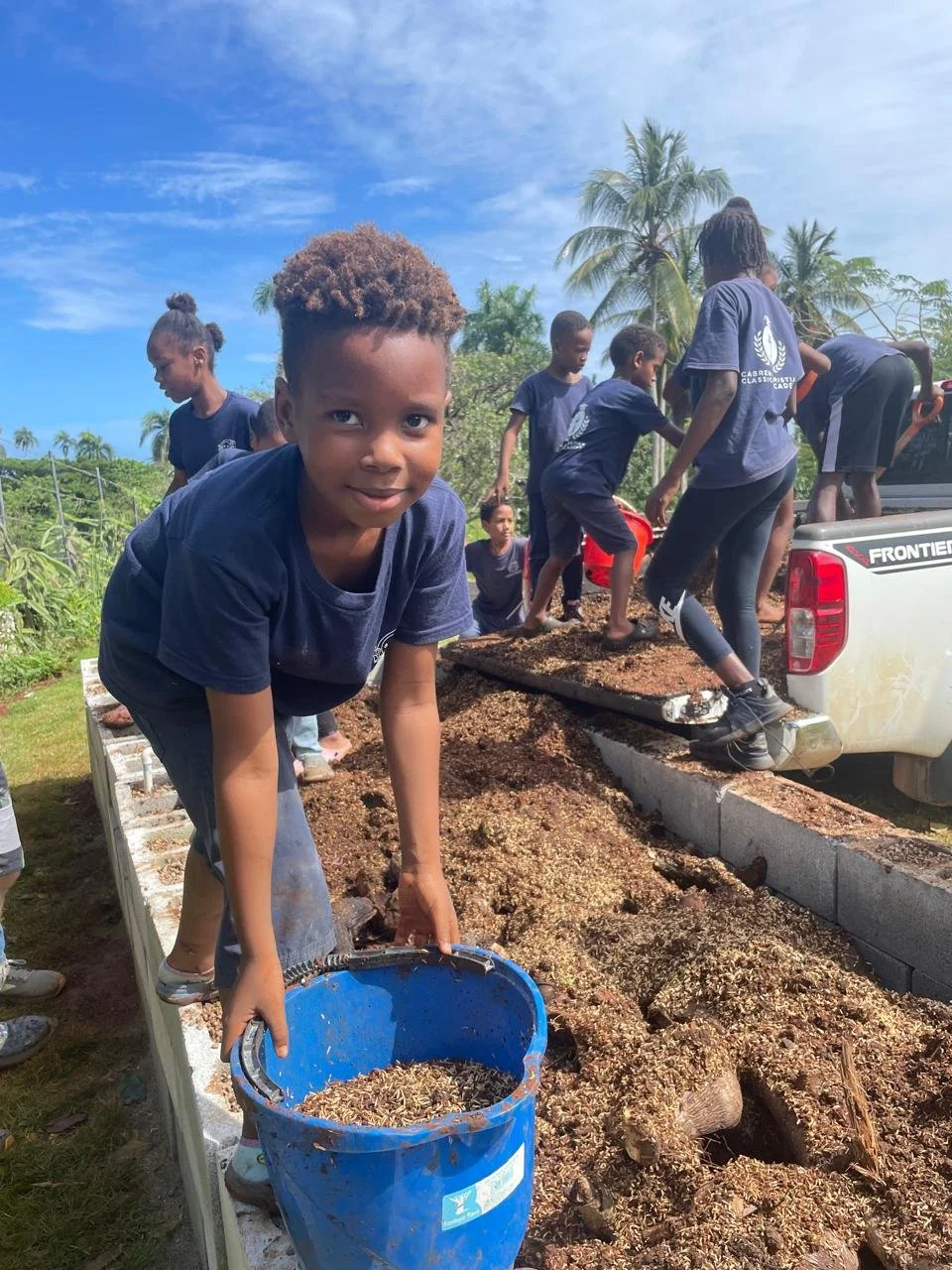 Student working in vegetable gardens