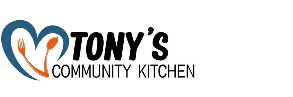 Logo for Tony's Community Kitchen featuring a blue heart with an orange fork and spoon inside, and the text 'Tony's Community Kitchen'.