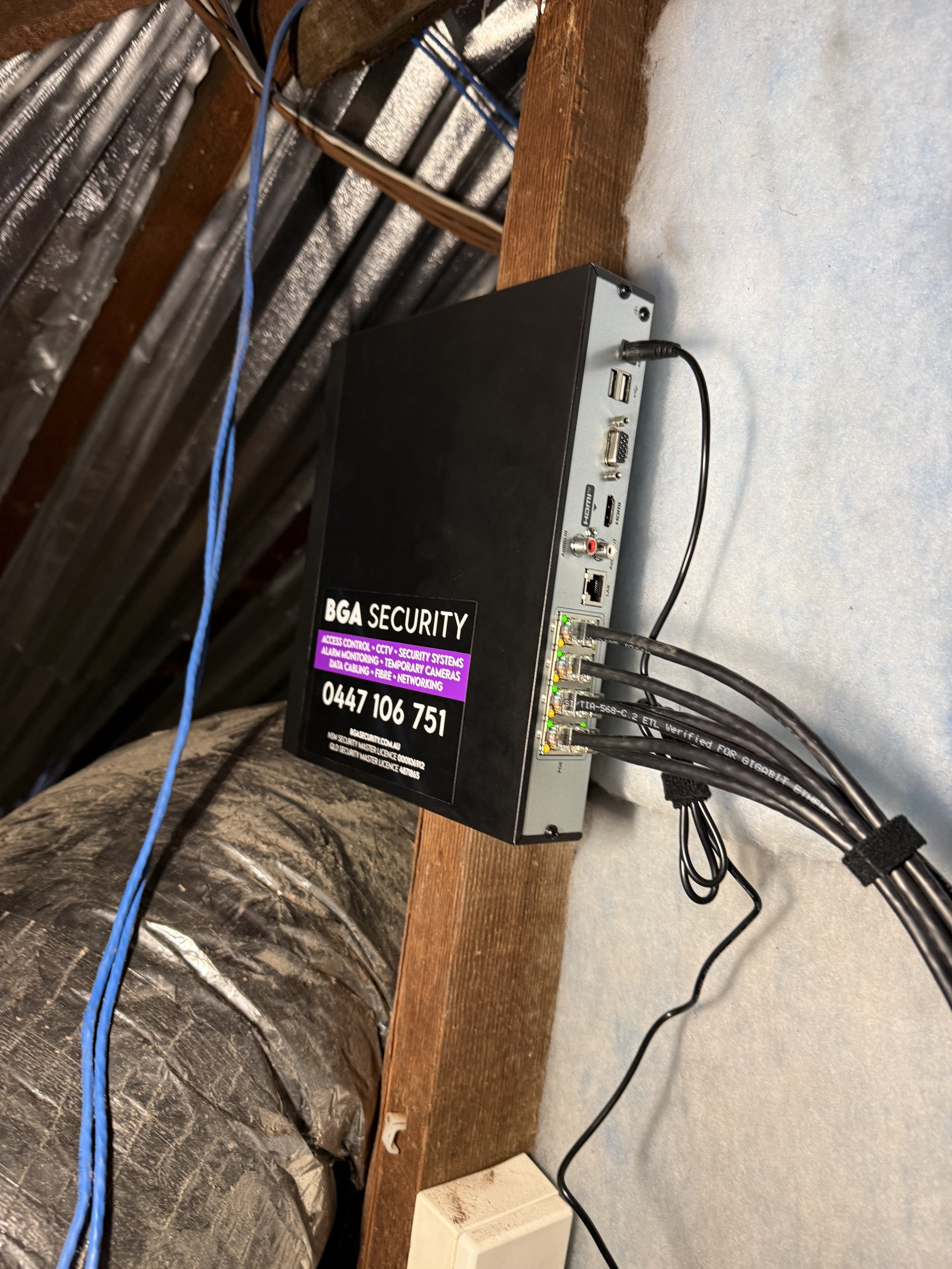 HiLook NVR with BGA Security branding and neatly combed CAT6 cables.