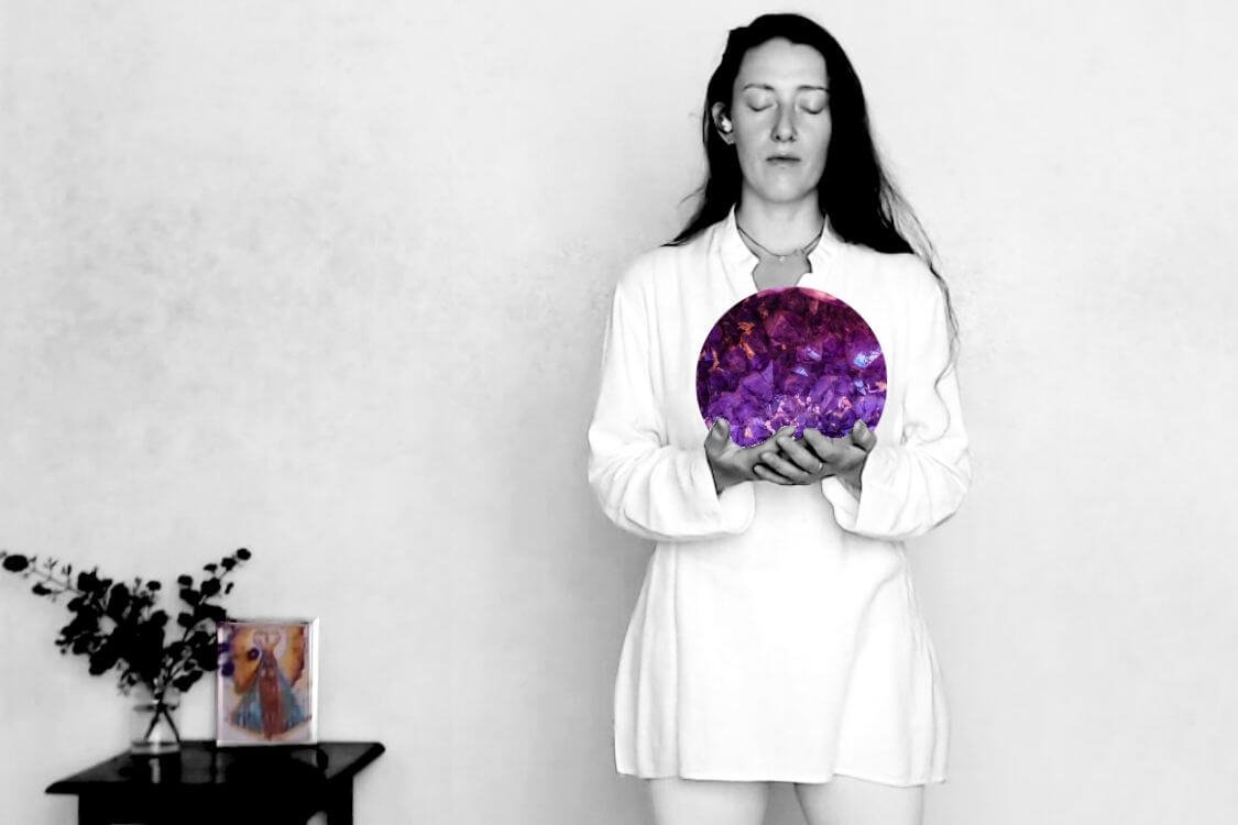 muse holds a large crystal ball