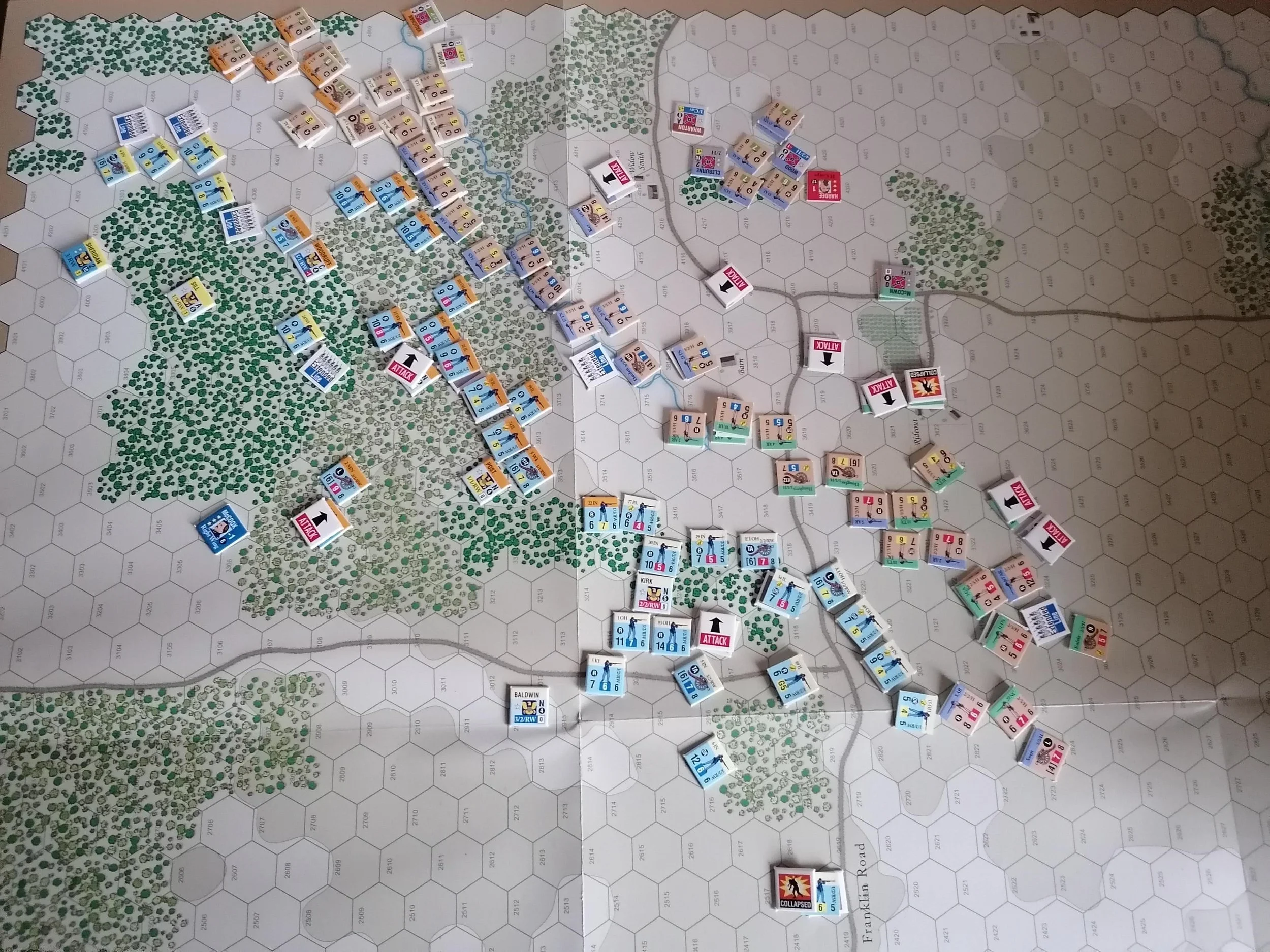 A photo of one of the scenarios from Dead of Winter with at least 60 counters on it, like the picture is mostly counters on one corner of a map.
