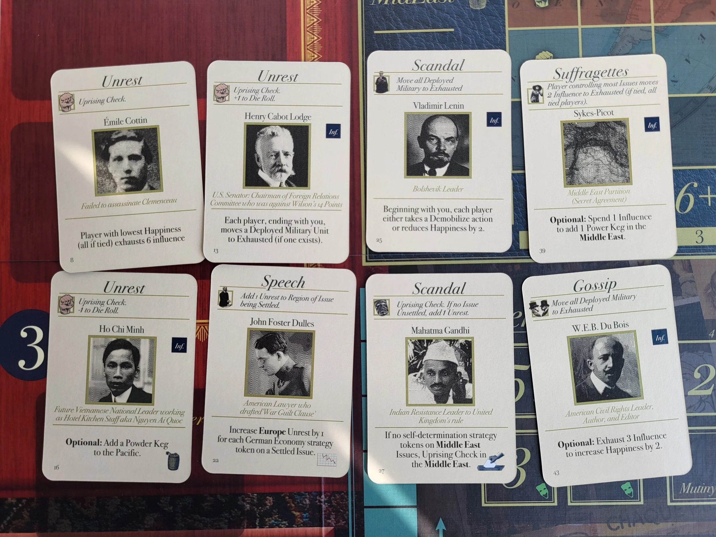 Eight event cards laid out on the board. They are: Emile Coesin, Henry Cabot Lodge, Vladimir Lenin, Sykes-Picot, Ho Chi Minh, John Foster Dulles, Mahatma Gandhi, and W.E.B. Du Bois