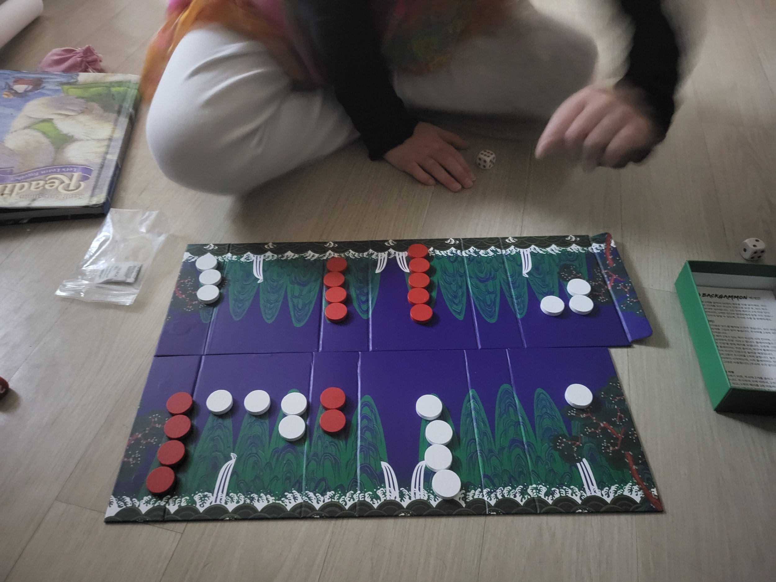 My daughter making her move at backgammon