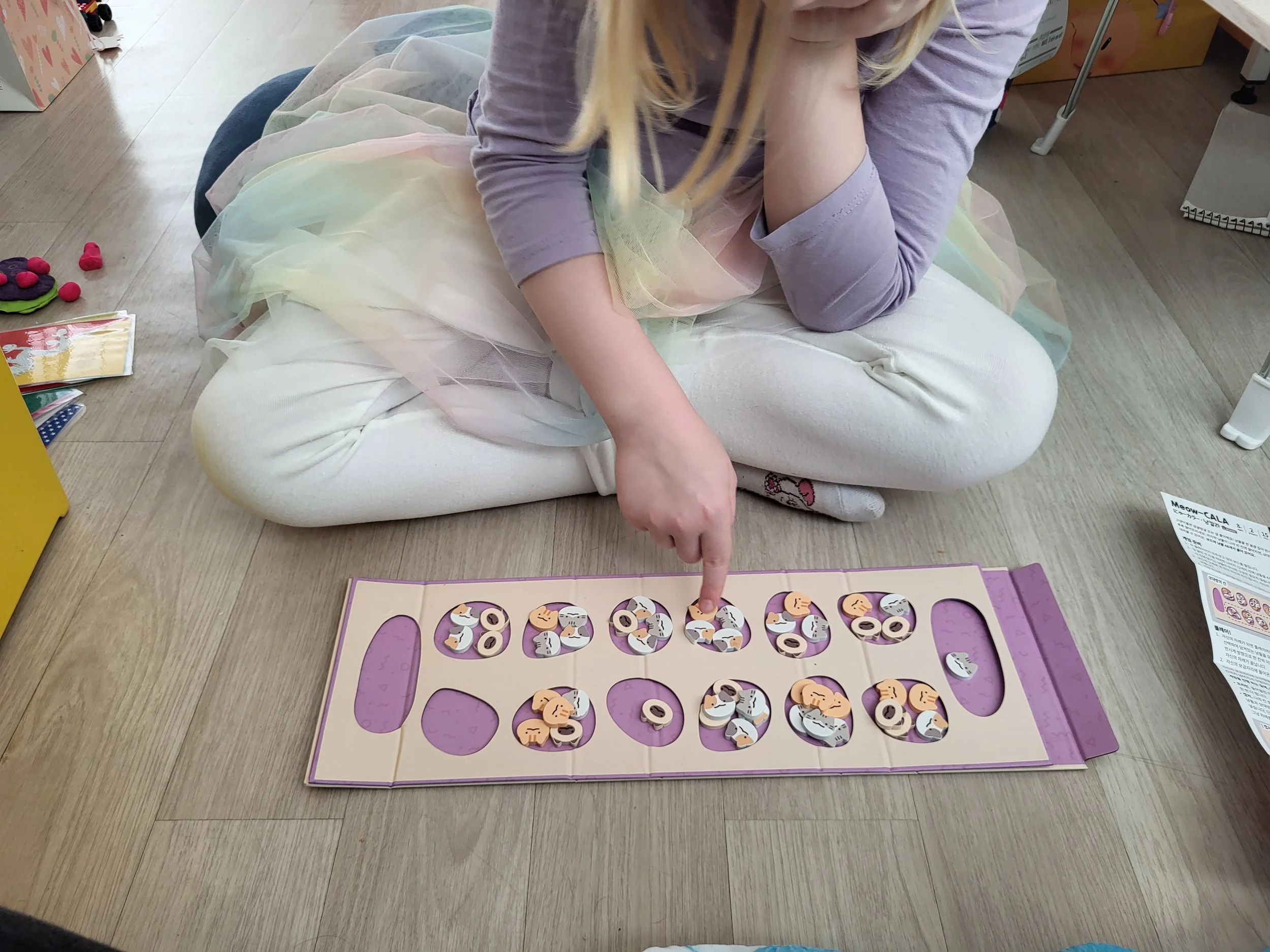 My daughter contemplating her move at Meowcala