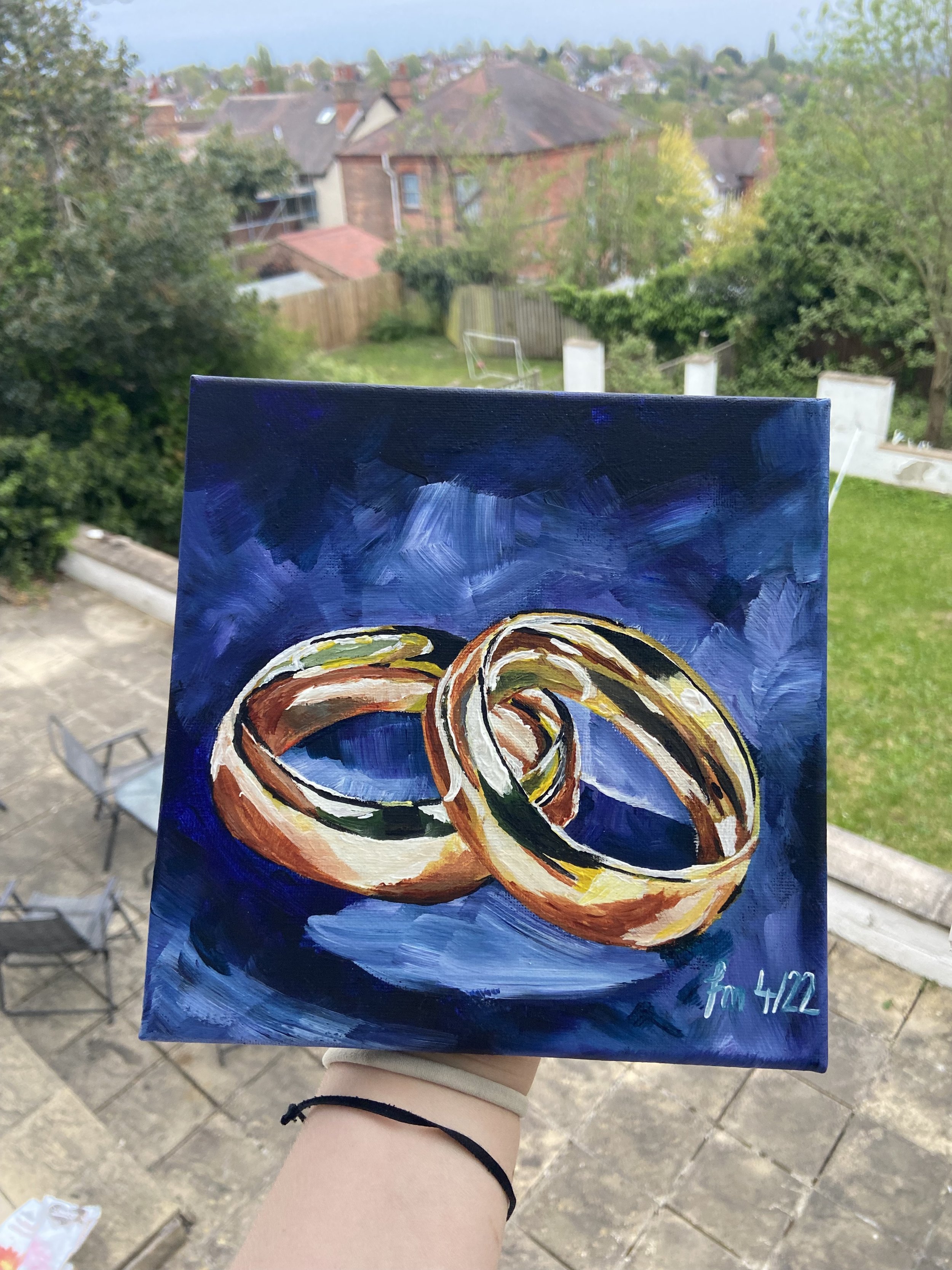 This art print is a perfect gift idea for a newly-wed couple close to your heart. The shiny gold colour of the rings just pops perfectly on the dark blue background.