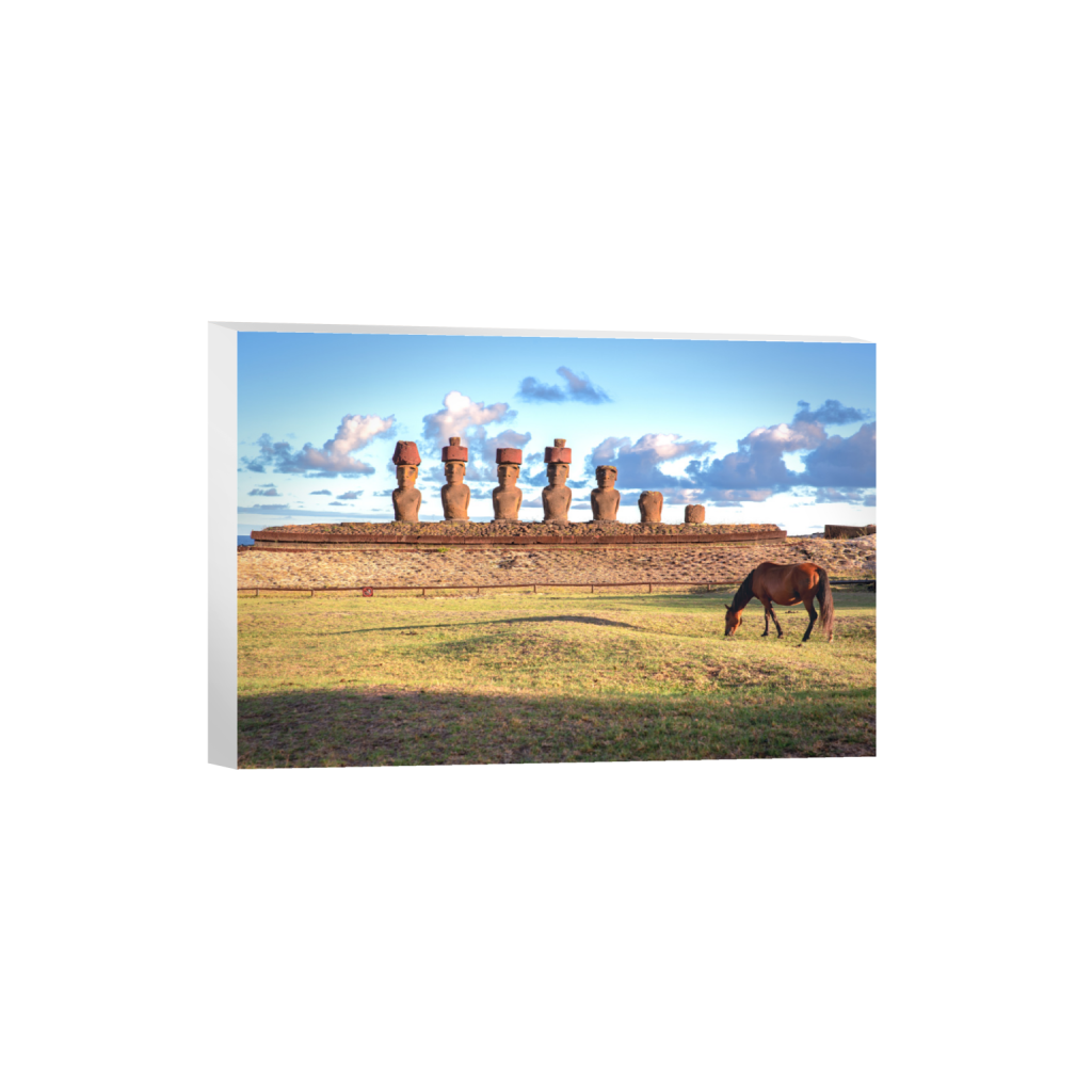 Moai statues at sunrise on Easter Island at Ahu Nau Nau with a horse grazing in the foreground canvas
