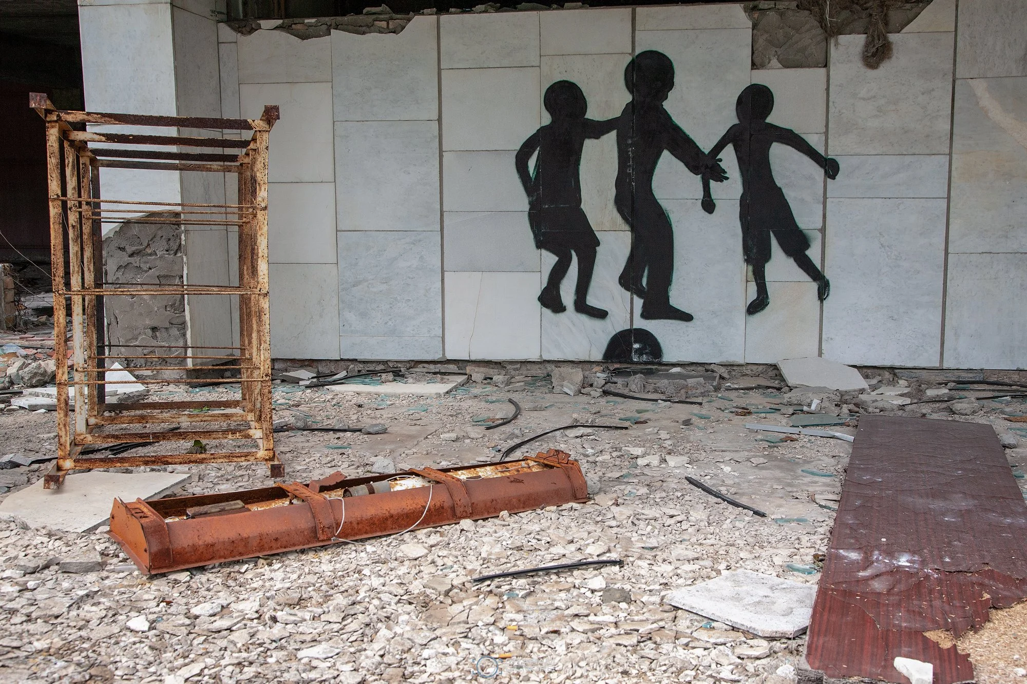 silhouette graffiti of children inside abandoned building in Pripyat Ukraine