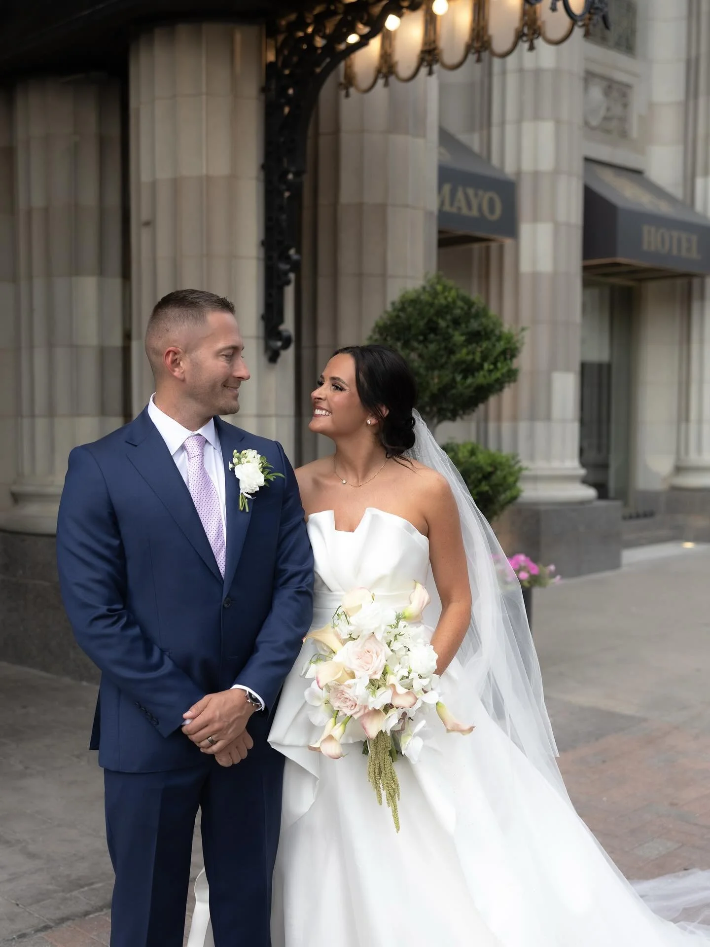 Our #LMBride Kyleigh in her gorgeous gown on her beautiful day. We are so lucky to have been part of such a special celebration! Congratulations to the newlyweds!✨🤍

Bride | @kyleigh.brooke 
Photographer | @meltonphotography__ 
Florals | @eversometh