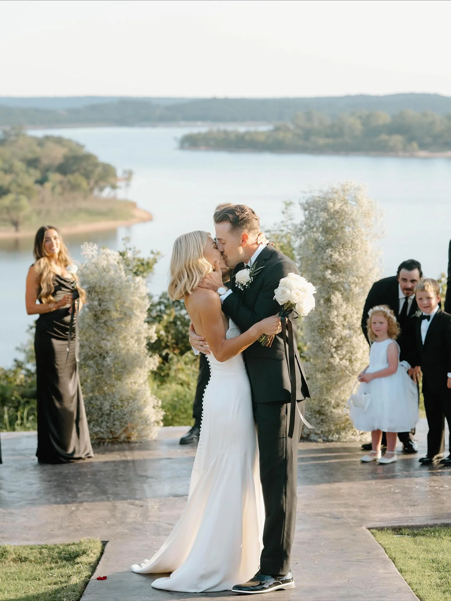 Love by the lake✨🦢

Carlie looked absolutely breathtaking in her @jennyyoonyc gown on her bright &amp; beautiful day! We can all see how special Carlie &amp; Tyler&rsquo;s big day was in these photos, with the gown, the couple, and the lakeside sett