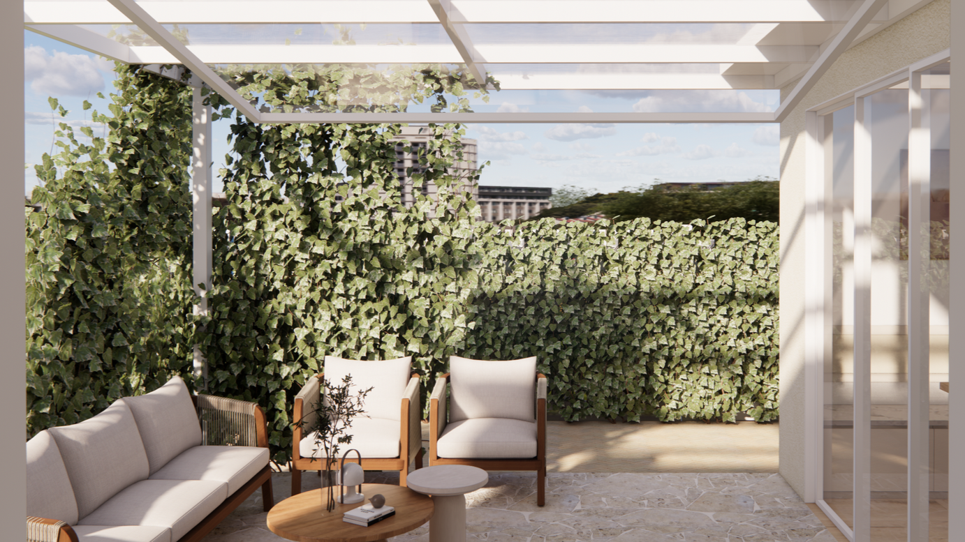 Outdoor patio with beige sofa and chairs, small round table with decorative items, green ivy wall, glass sliding door, and cityscape in the background.