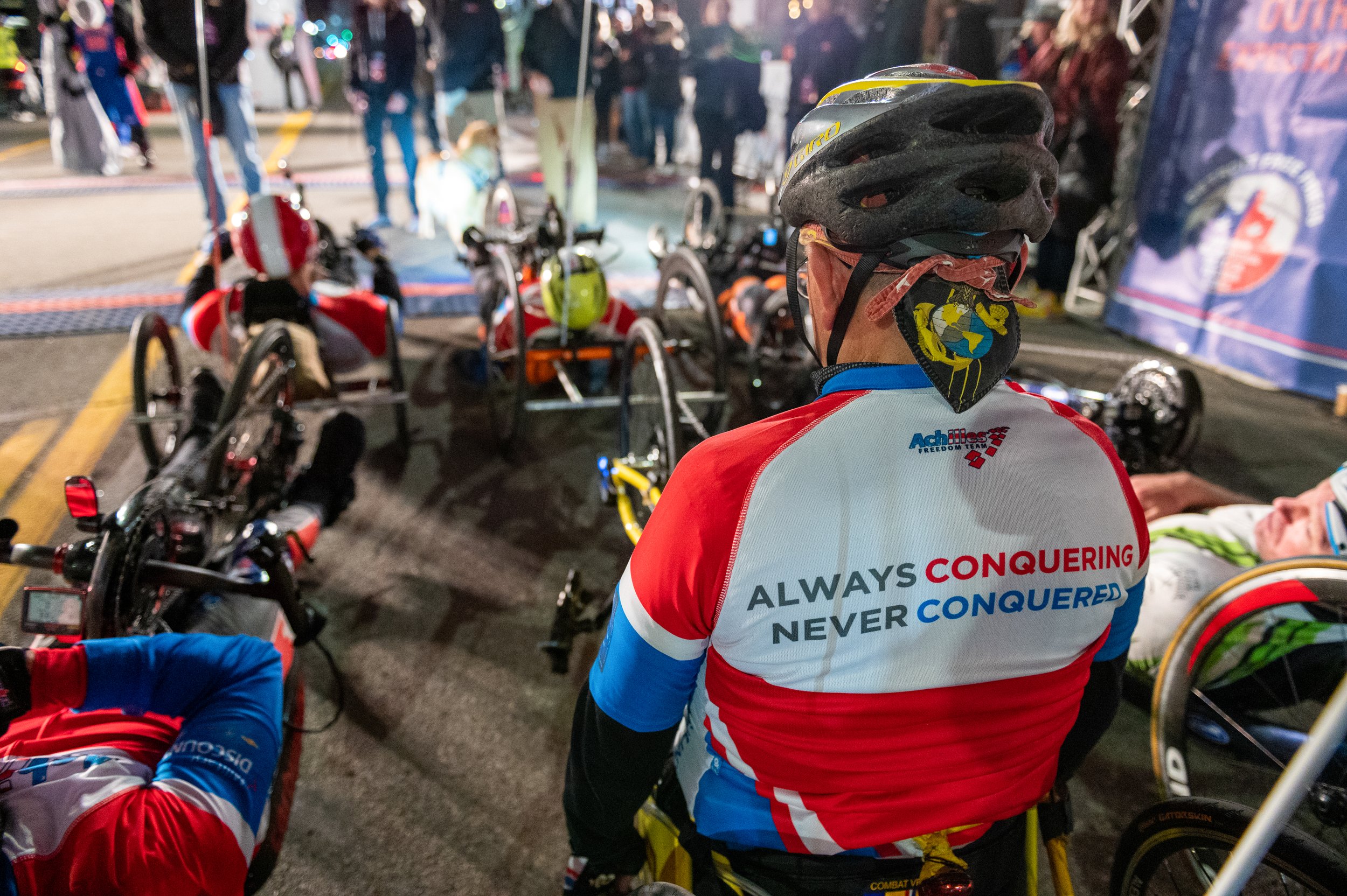  Photo of the back of the Achilles Freedom Team jersey which reads, “Always conquering, never conquered.” 