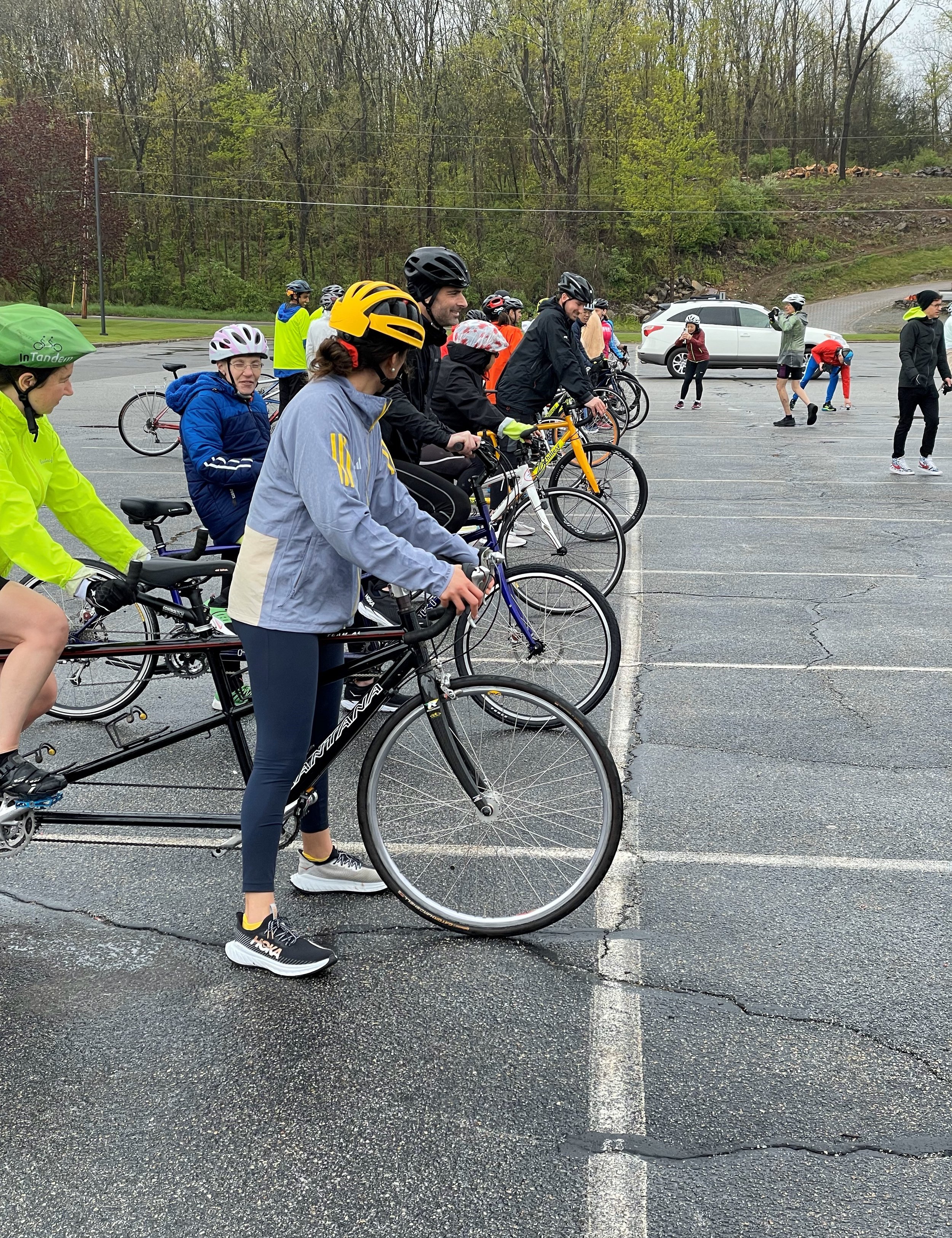  Achilles members practicing riding on tandem bicycles together  