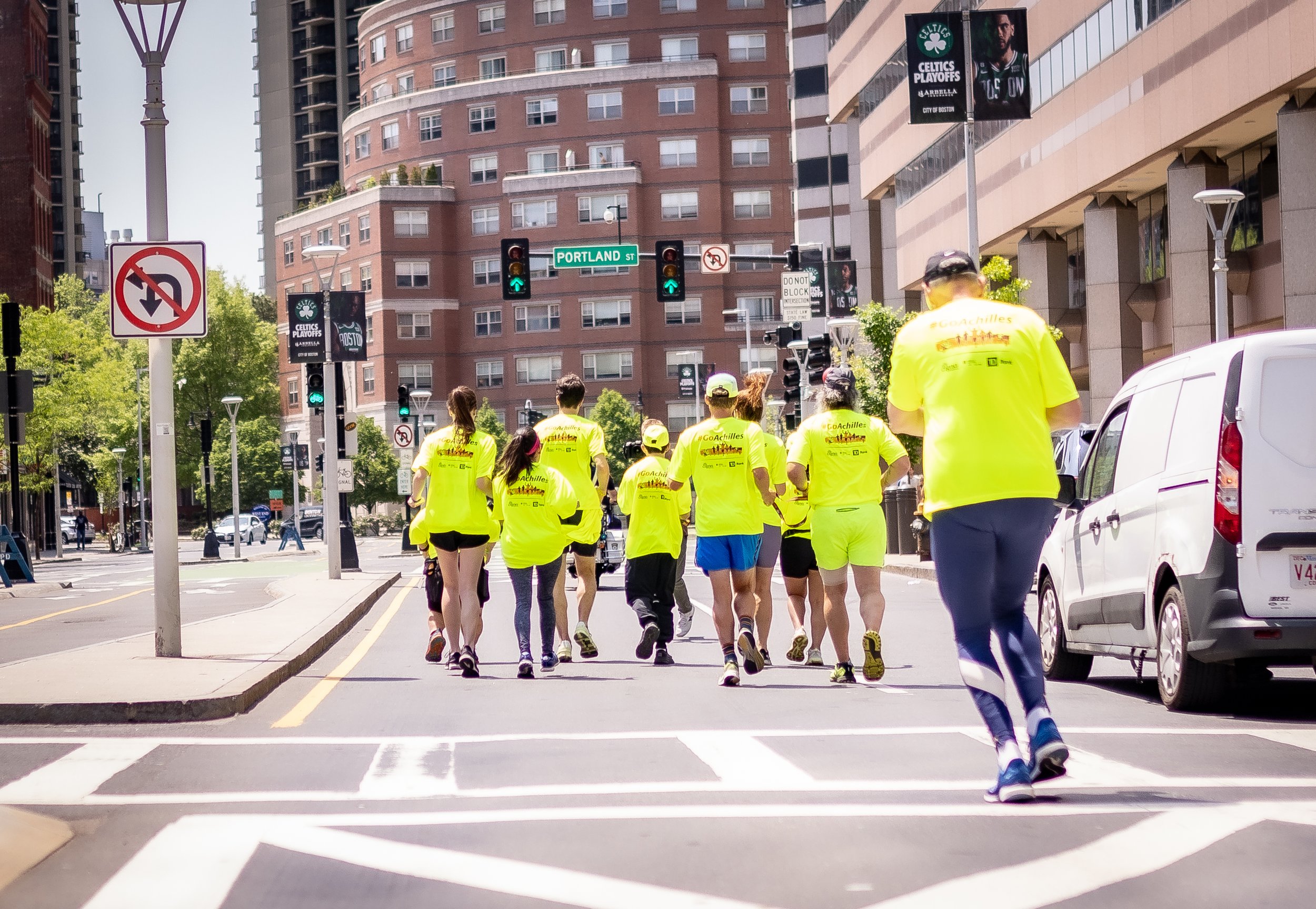  Achilles members running together on the streets of Boston 