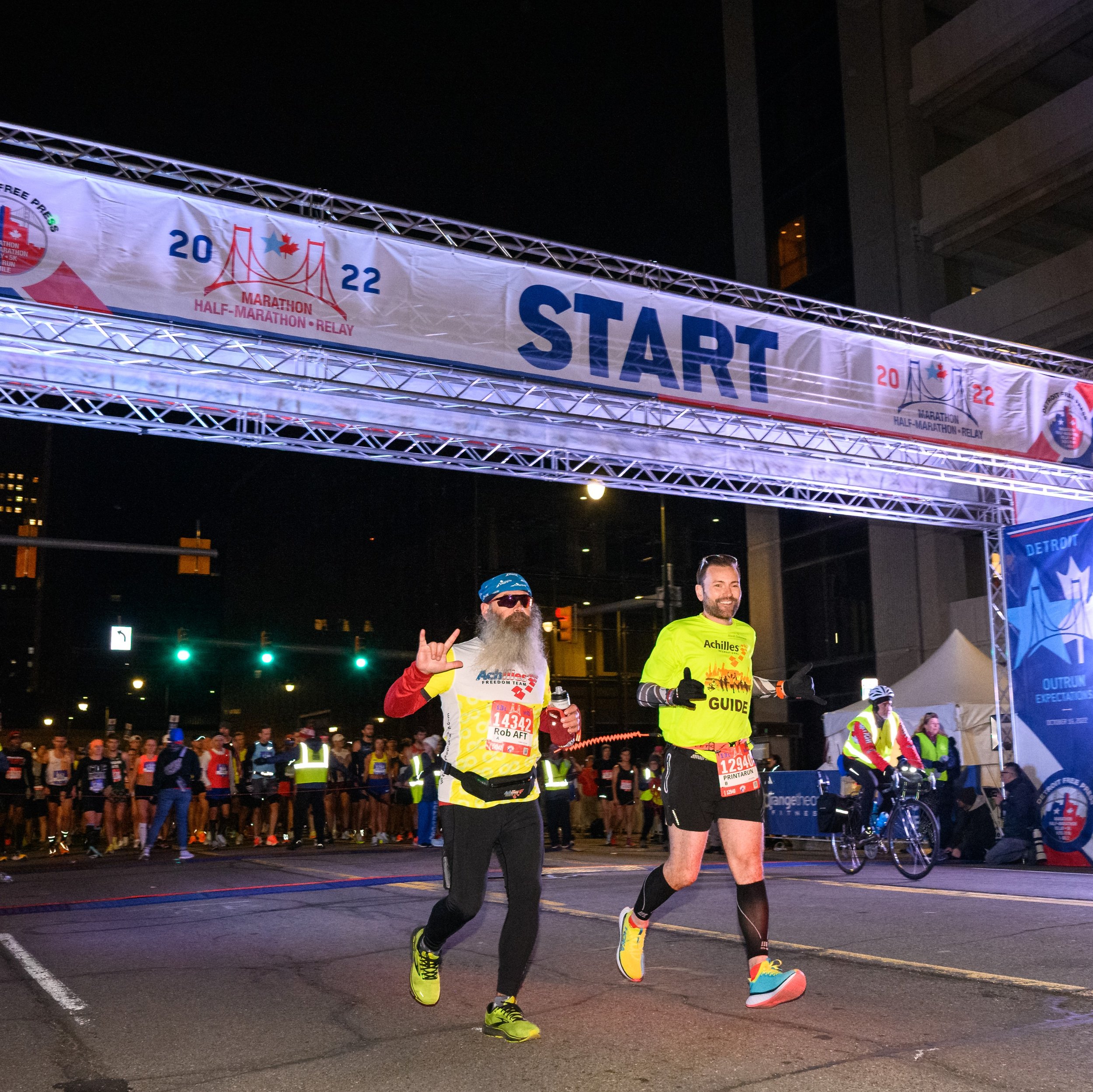  Achilles Freedom Team athlete and his guide crossing the start line at the Detroit Marathon 