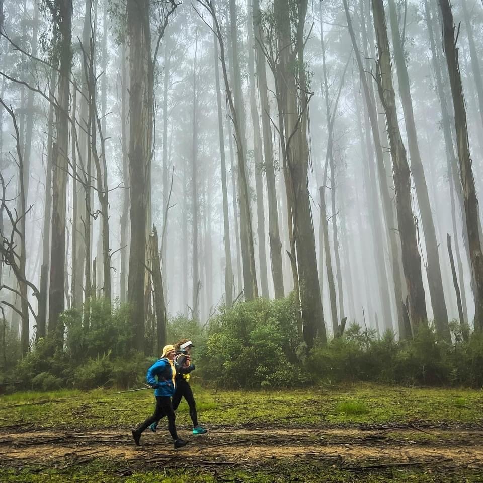  Claudia running with her guide 