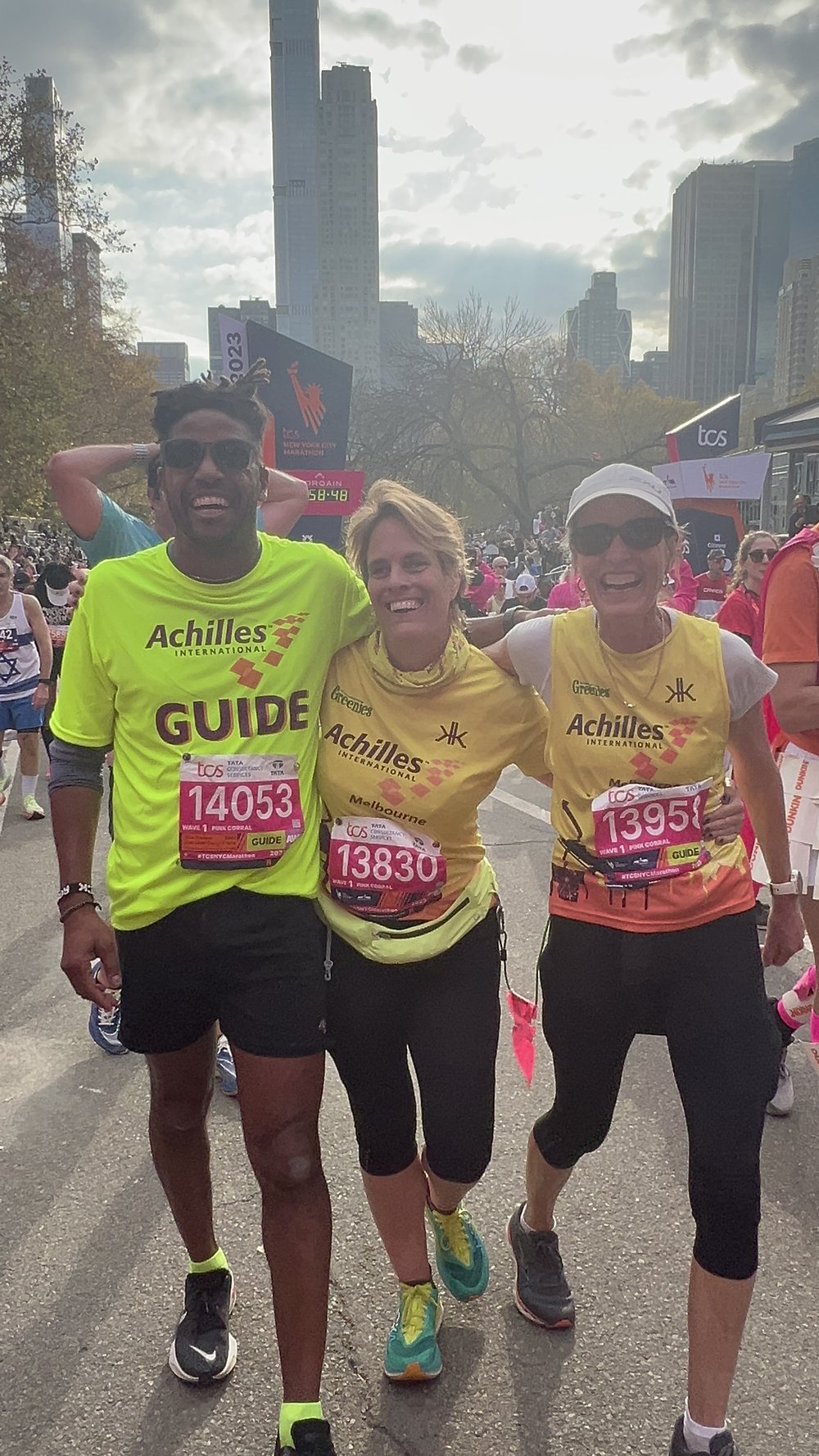  Claudia Stevenson posing with Knox Robinson and her other Achilles Melbourne guide after they crossed the finish line  