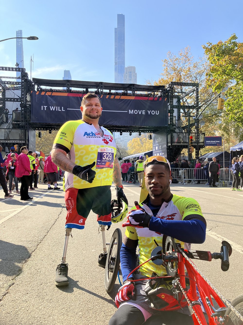  Achilles Freedom Team athletes posing together at the NYC Marathon finish line  