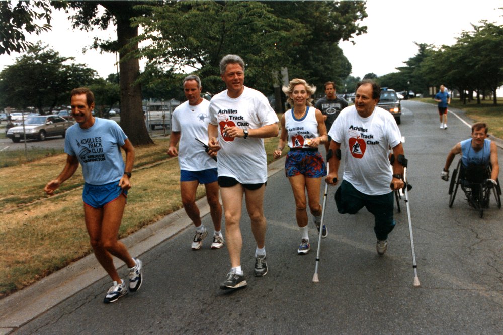  Dick Traum running alongside former president Bill Clinton  